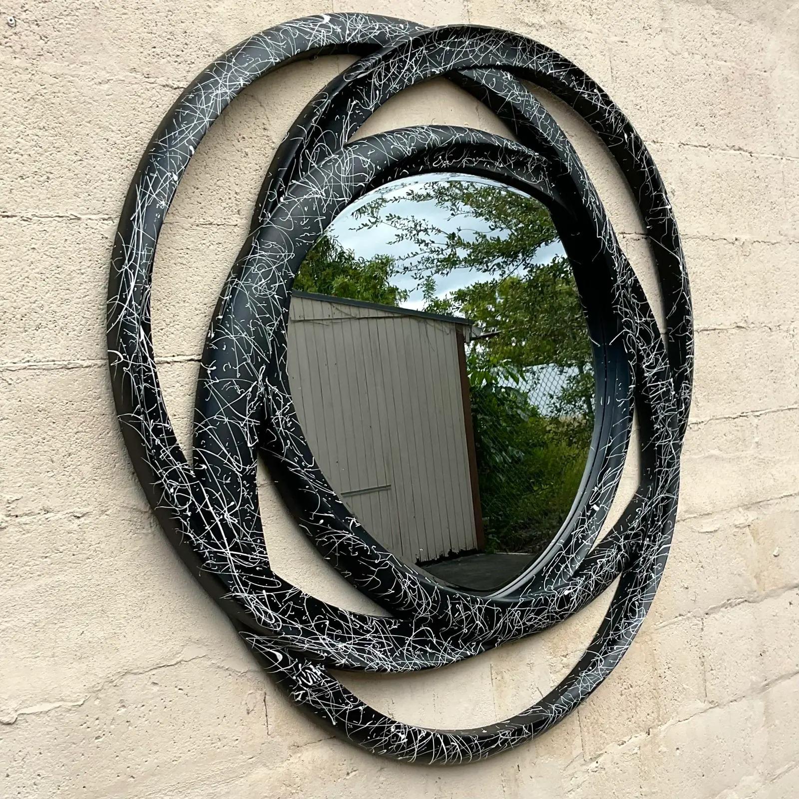 A fantastic vintage monumental wall mirror. Fabulous rings design with a splatter paint finish. Perfect as is or re-imagine in a new color! You decide! Acquired from a Palm Beach estate.