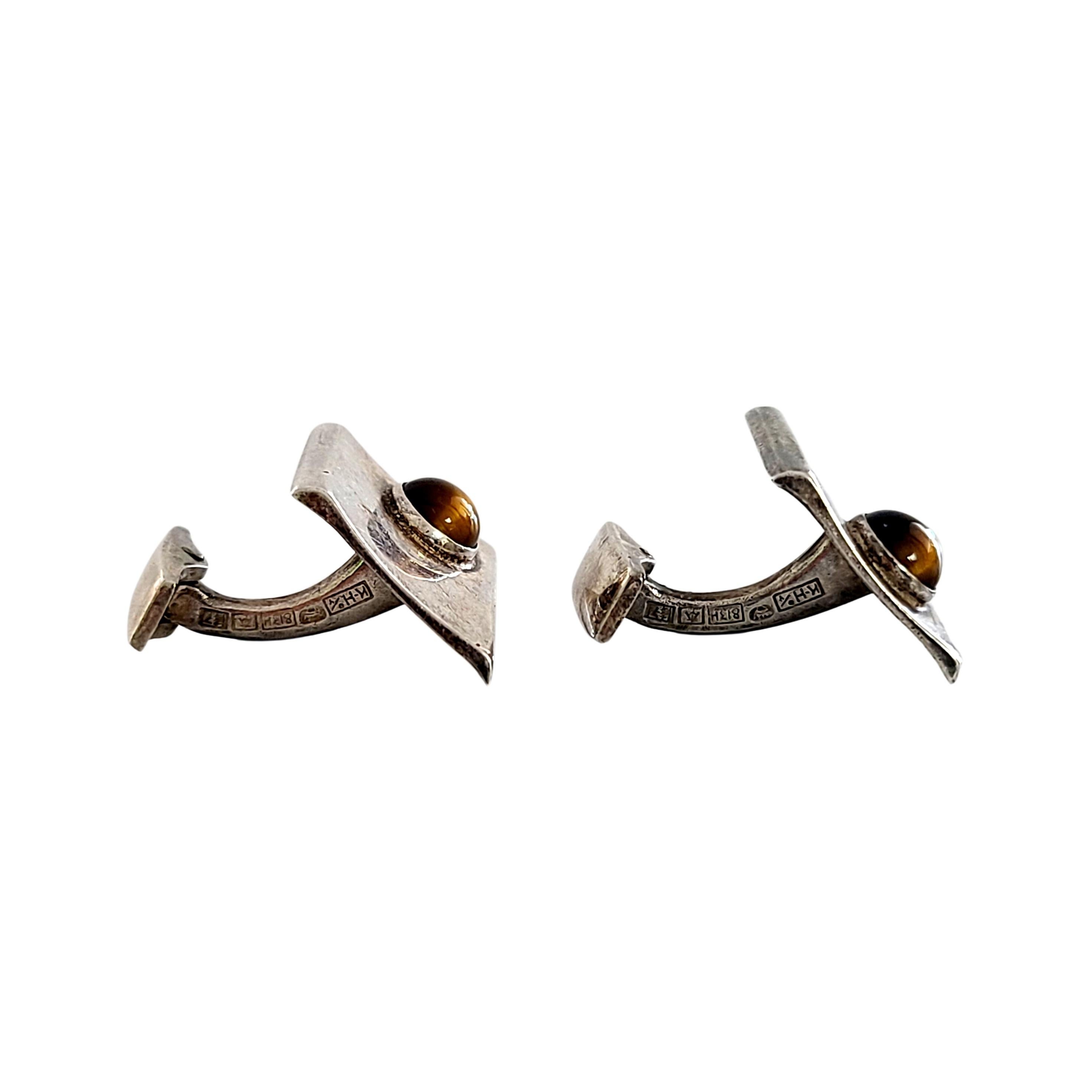 Vintage 813 silver and tiger's eye cuff links, circa 1961.

Unique piece of modern design in .813 fine silver by a designer of Finland.

Cuff links measures approx 7/8