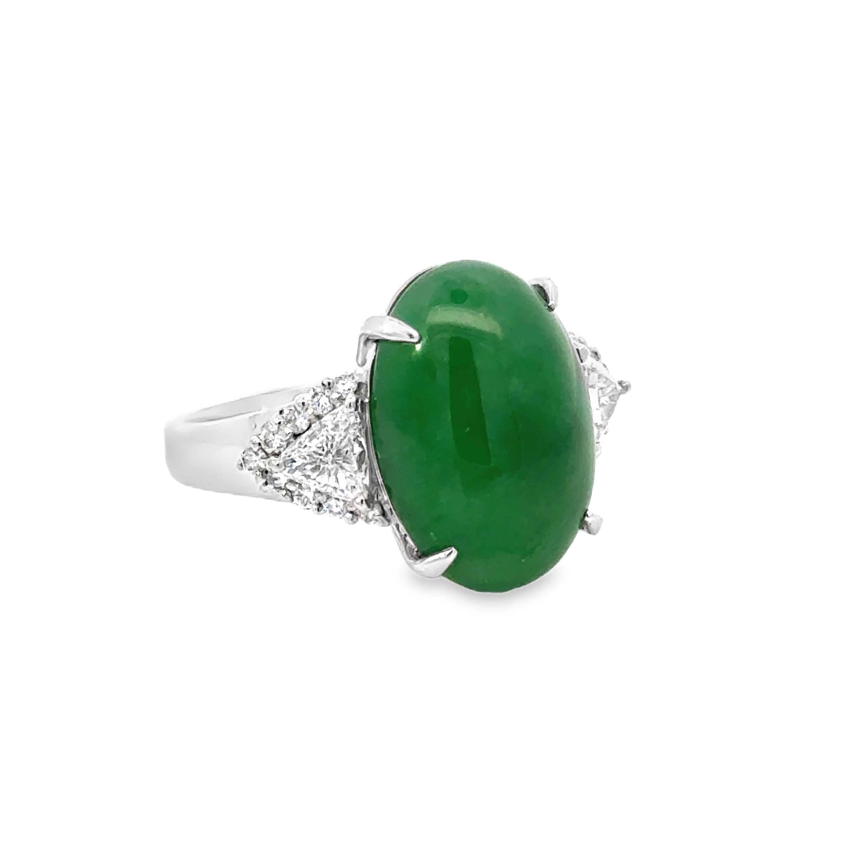 Experience the elegance and history of our Vintage 8.15 Carat Natural Jade, Diamond and Platinum Ring. The striking jade center, known for symbolizing hope, healing, good luck, and good fortune, is sure to make a statement. With its timeless design