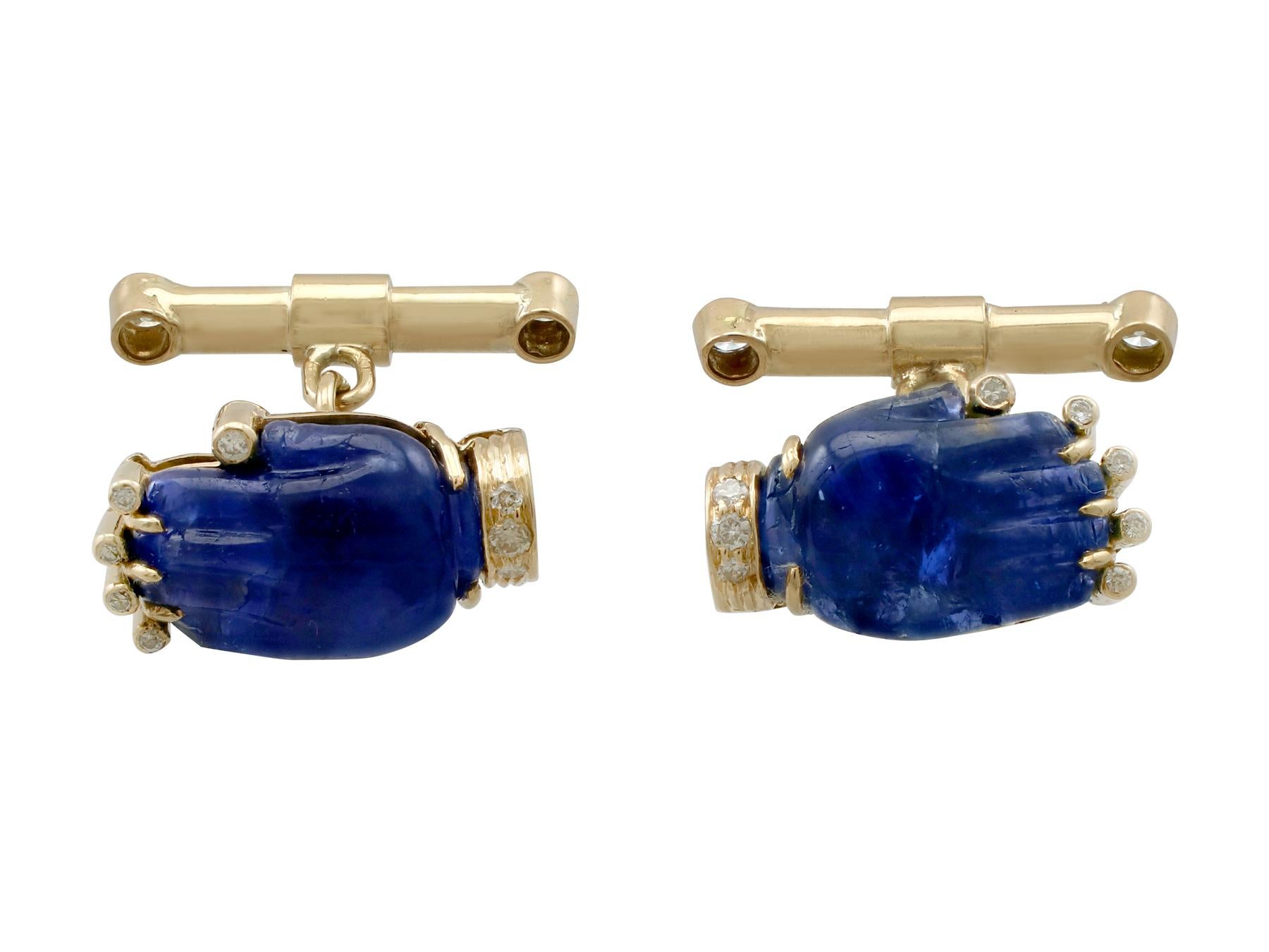 An impressive pair of vintage 8.23 carat sapphire and 0.24 carat diamond, 15 karat yellow gold cufflinks; part of our diverse gemstone jewelry and estate jewelry collections.

These fine and impressive vintage sapphire cufflinks have been crafted in