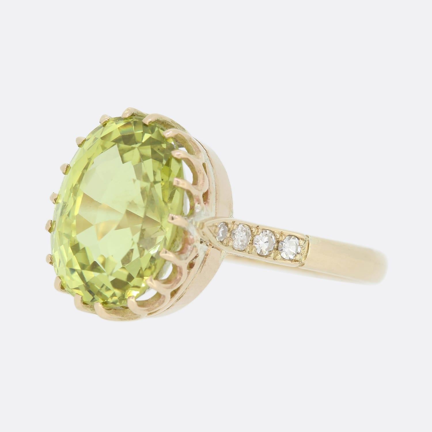 This is a vintage yellow chrysoberyl solitaire ring. The centre stone is an oval cushion cut, a greenish yellow tone and set in a raised 18 claw mount. On each shoulder there are a further 4 'eight' cut diamonds.

Condition: Used (Very Good)
Weight: