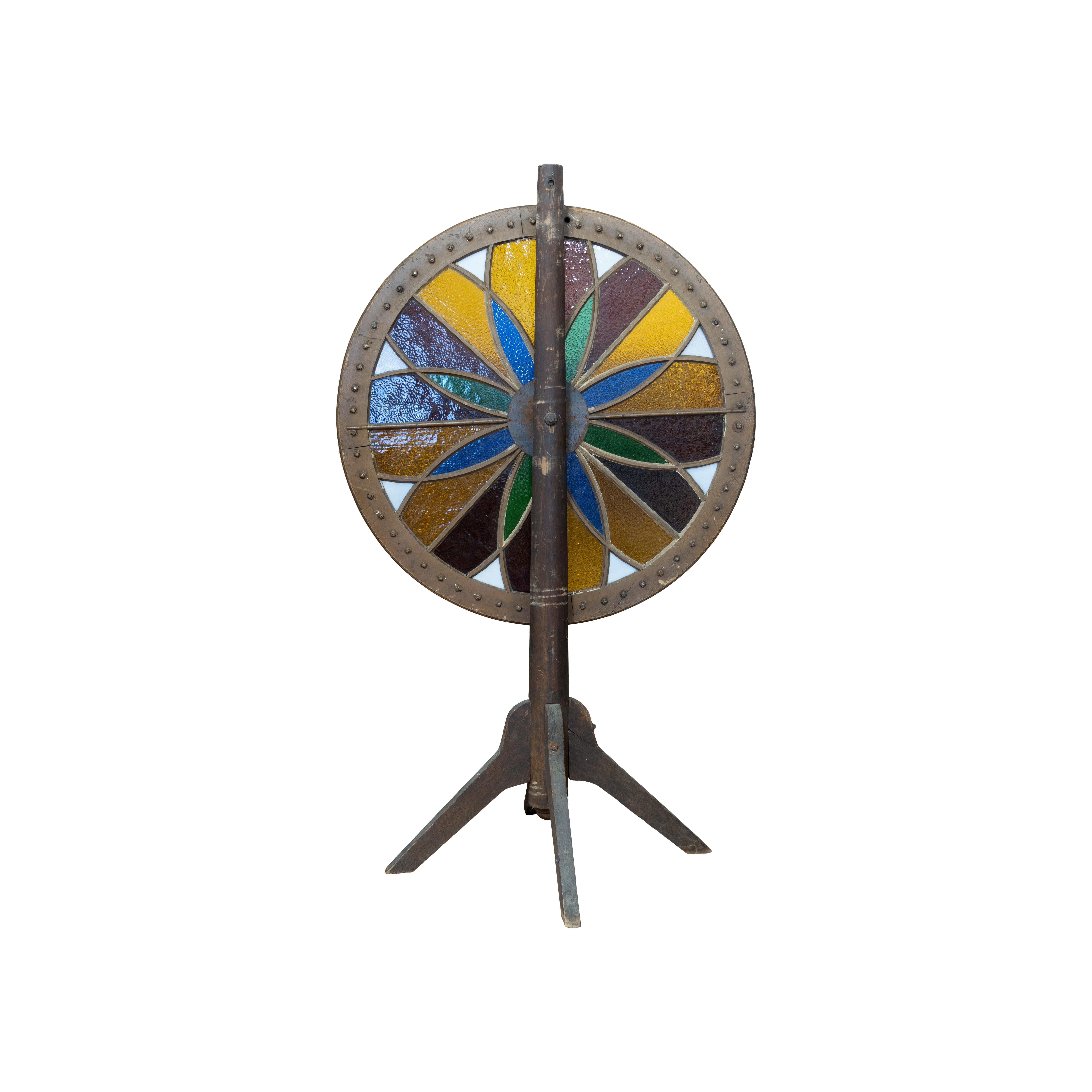 Vintage gambling wheel with colored glass. Three winner options - red, black or star. Came from a gambling house along the Mississippi River. Older than most. Perfect for bar, game room, gentleman's clubs, etc. Neat and hard to find. Great condition