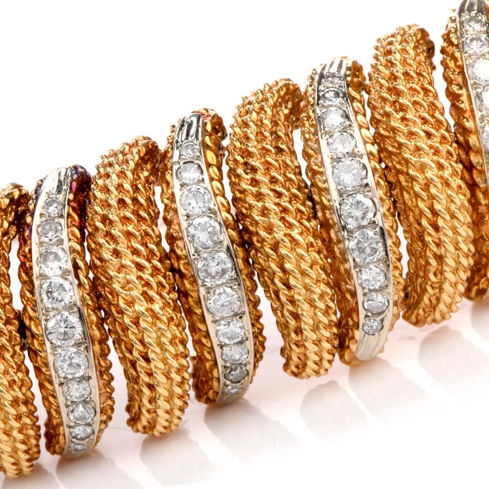 This fashionable vintage bracelet is crafted in solid 18-karat yellow gold, 
weighing 116 grams and measuring 6 ½” around the wrist x 22mm wide. 
Composed of elongated oval links textured with rope gold design and pave-set with 180 round-cut