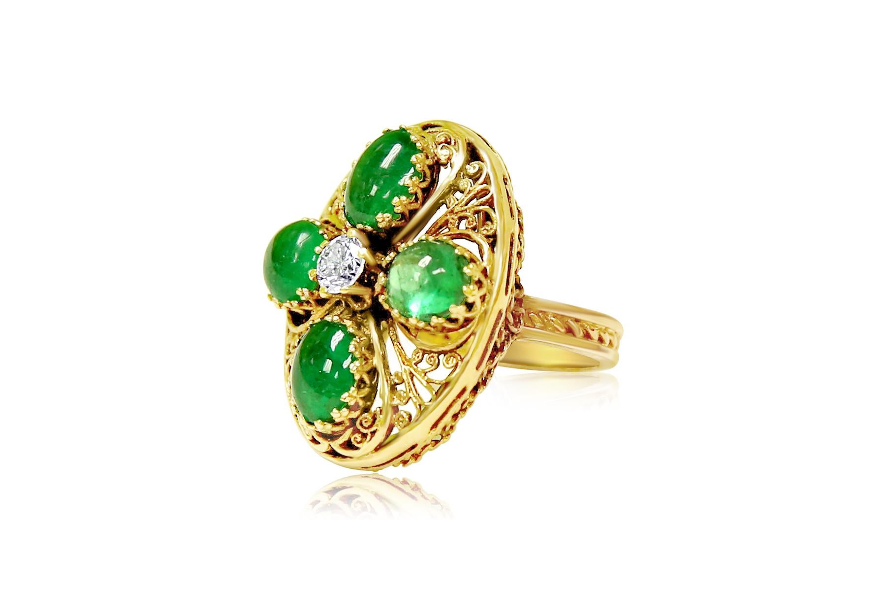 Metal: 14K Yellow Gold. 

Emerald: 8.00 carats total. 100% natural earth mined Emerald. Cabochon cut set in prongs. 

Diamonds: 1/2 carat diamonds. Round brilliant cut diamonds in prongs. 100% natural earth mined.

Artistic vintage style ring. 