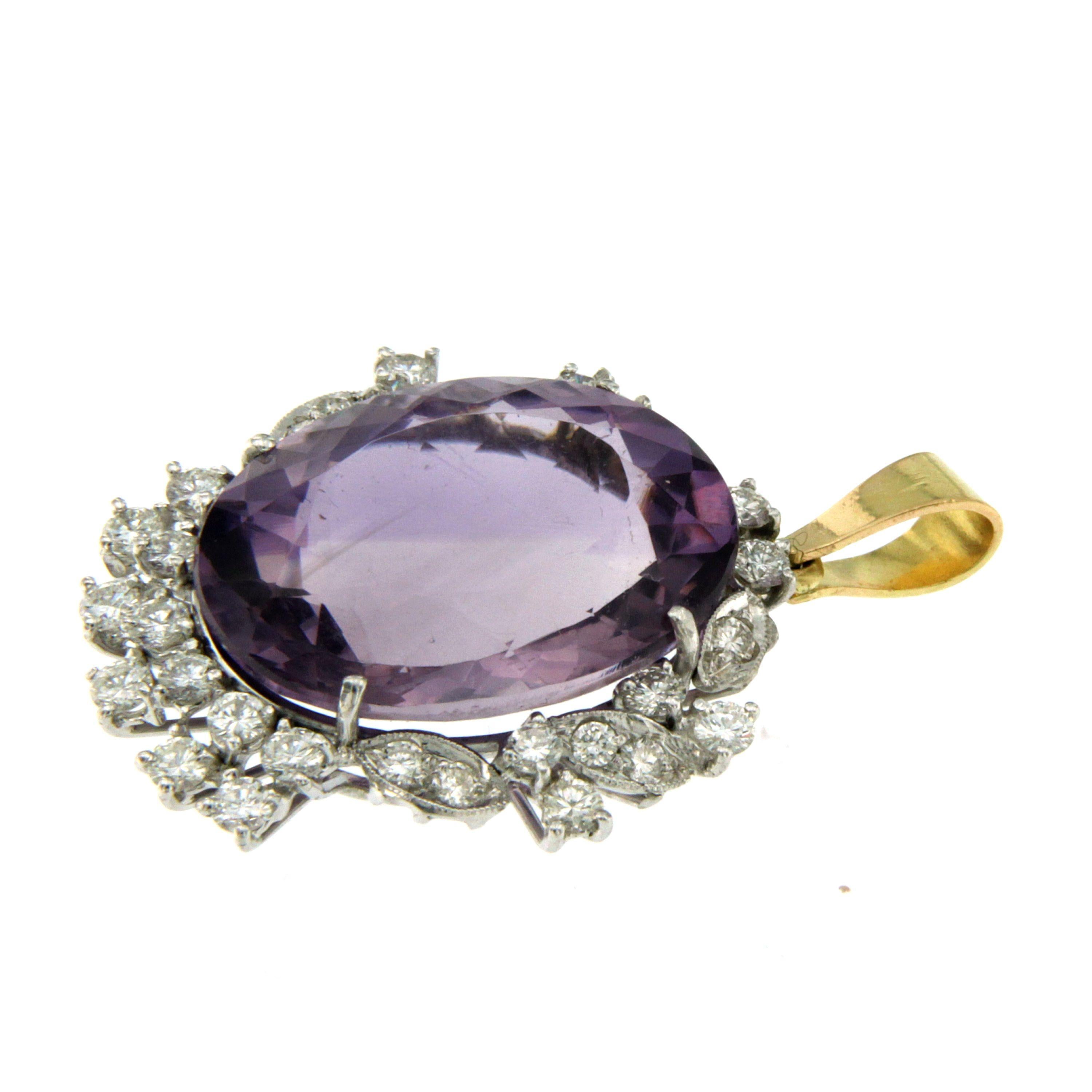 18k White and Yellow Gold (only the bail in yellow gold) Amethyst Diamond Pendant Necklace

This piece is crafted from 18k gold and weighs 7,35 grams. It features a beautiful Amethyst 9 carats surrounded approximately 1.50 ct Sparkling Round