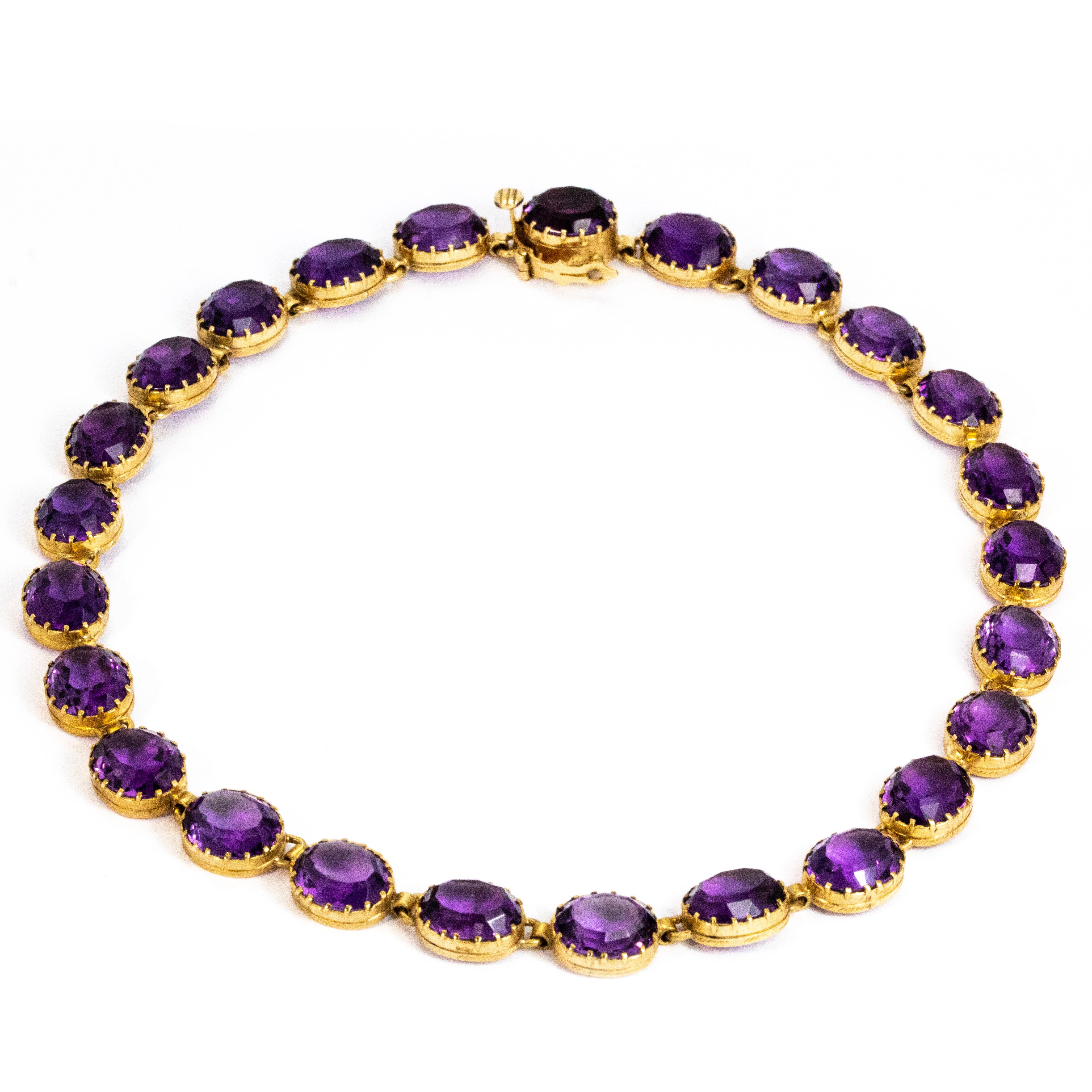 An exquisite vintage rivière necklace comprised of 25 sublime oval amethysts in wonderful deep pie crust claw settings. Modelled in 9 carat yellow gold. 

Necklace Length: 38.5 cm