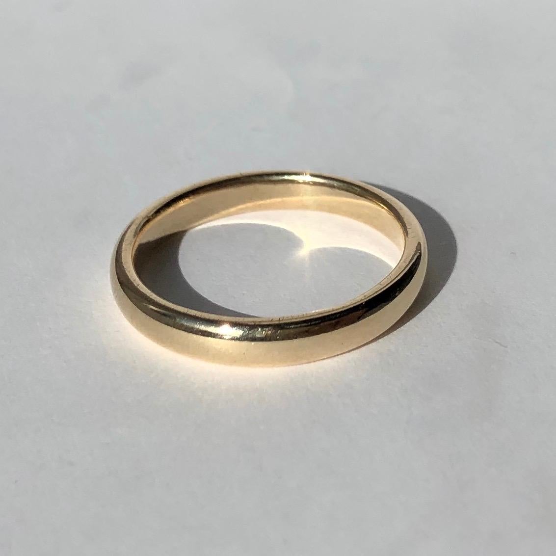 An 9ct gold band makes the perfectly classic wedding band or a great everyday wear piece. Made in London, England. 

Ring Size: M or 6 1/4 
Band Width: 2mm 

Weight: 2.46g