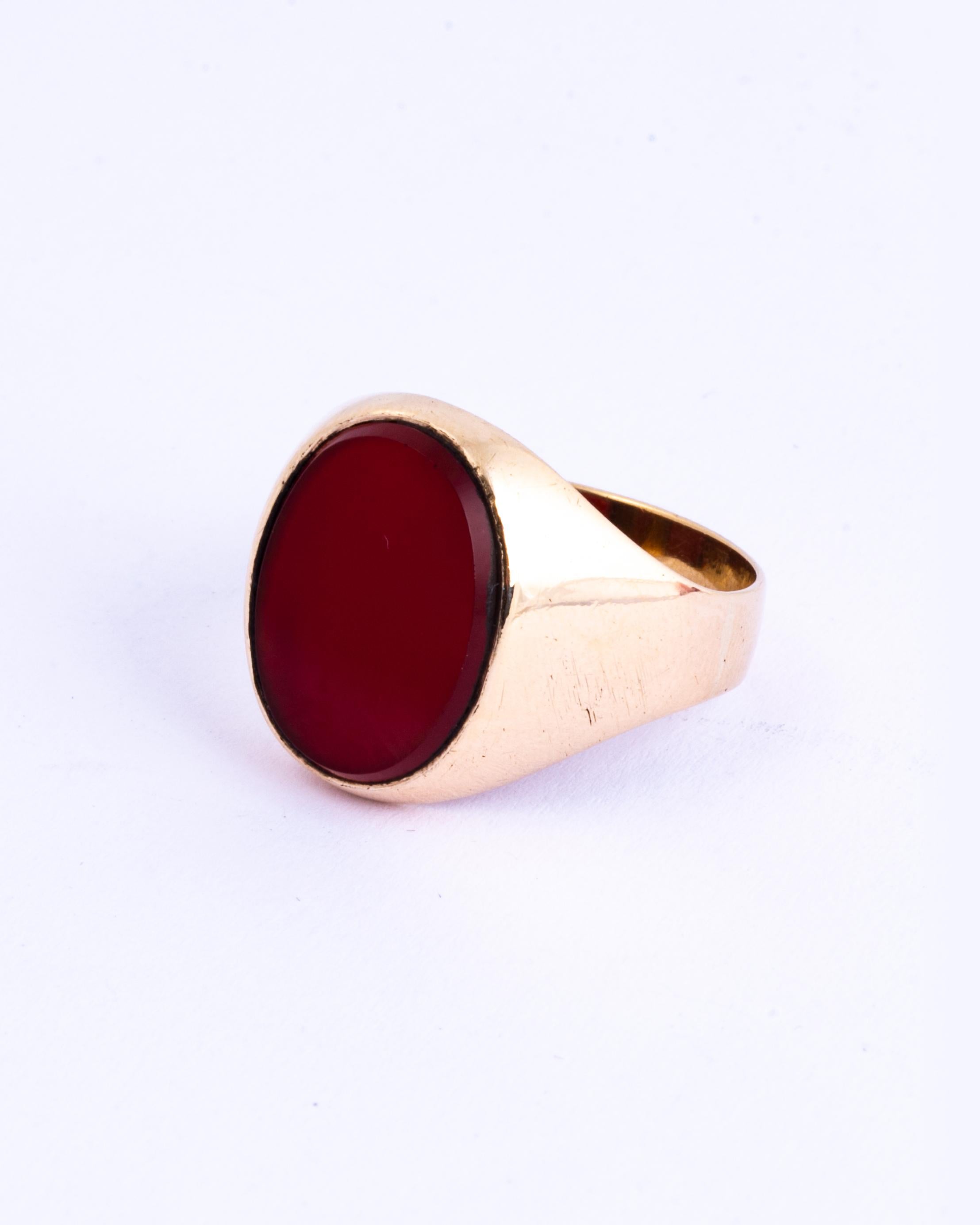 A fine vintage signet ring set with a flat cut oval carnelian Modelled in 9 carat yellow gold. 

Ring Size: T or 9 1/2
Stone Dimensions: 16x12mm

Weight: 5.1