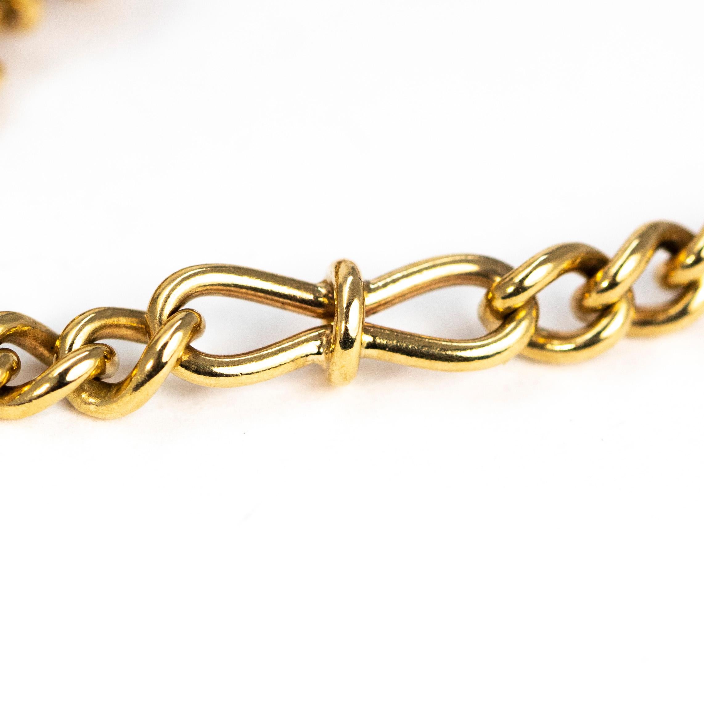 This gorgeous glossy gold chain is modelled out of 9 carat gold and is made up of a mixture of curb link and figure of eight links. This necklace is gorgeously packed with detail and has a great weight to it. 

Length: 34inches 
Chain Width: