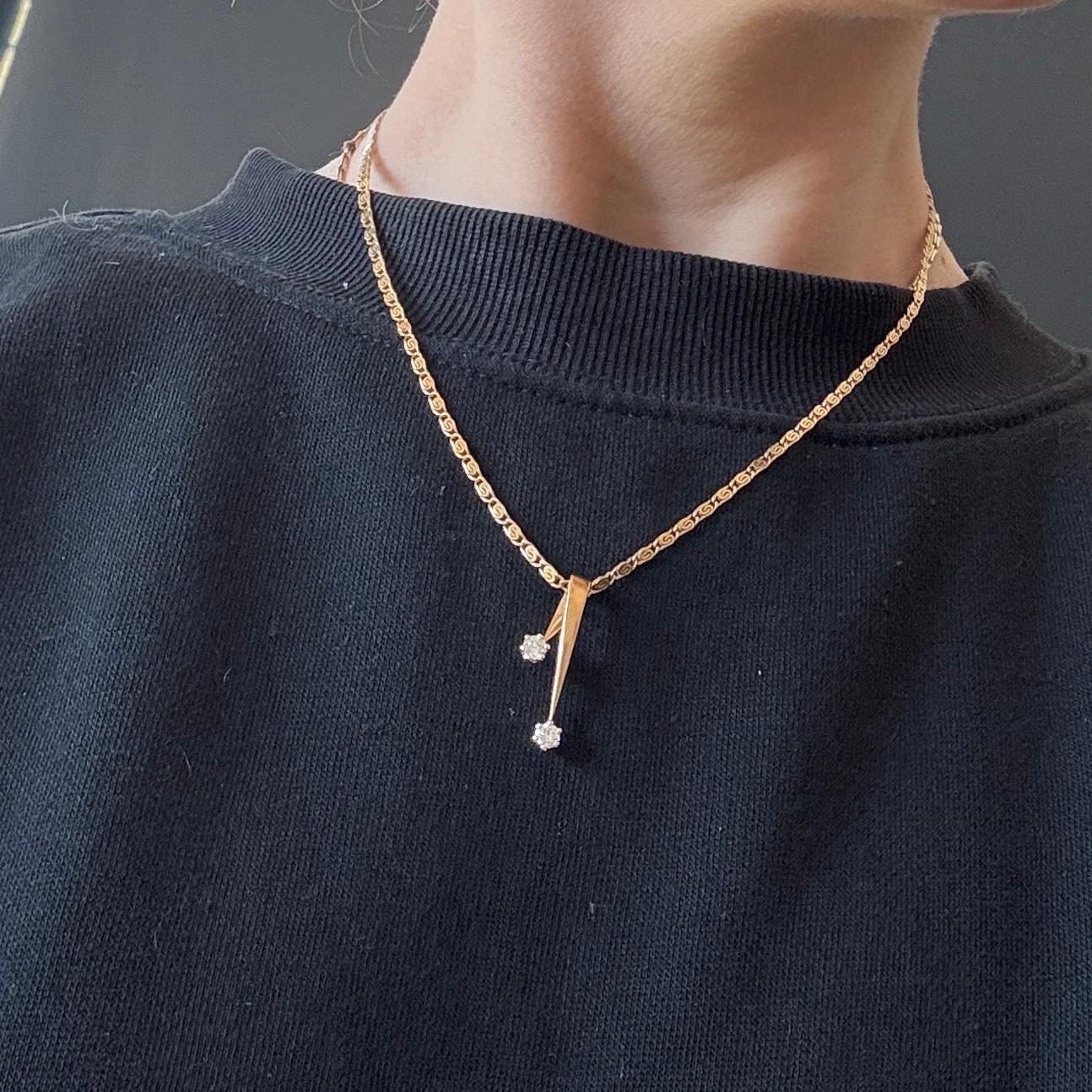 This ornate 9carat gold necklace holds a beautiful pendant also modelled in 9 carat gold and is set with two diamonds. The diamonds measure 20pts each.

Pendant Drop: 27mm
Chain length: 42cm

Weight: 8.8g