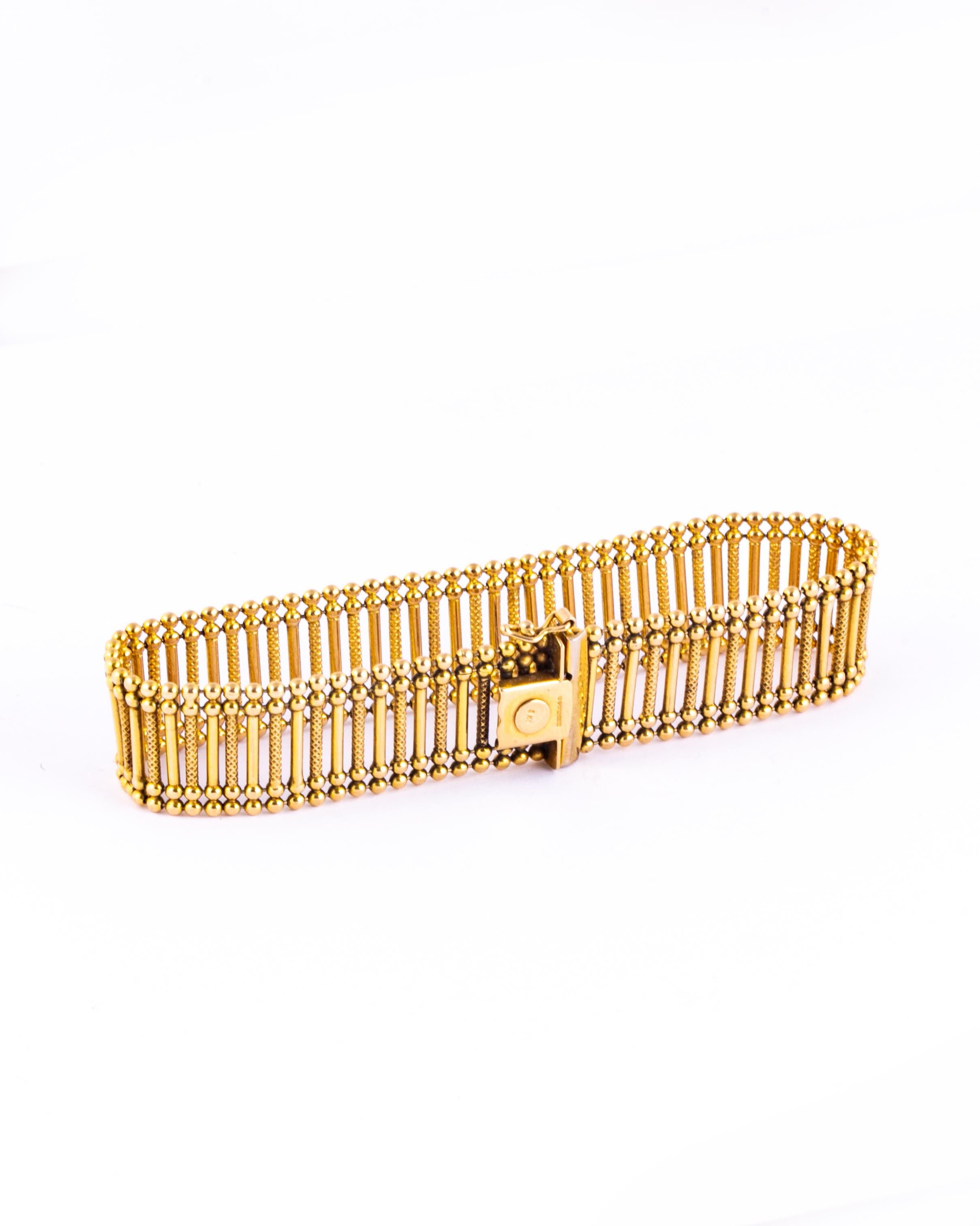 This stunning 9ct gold bracelet is so fancy! It is made up of a smooth and textured batons. The bracelet feels very fluid and is comfortable to wear. 

Length: 19.5cm 
Width: 15mm

Weight: 17.1g