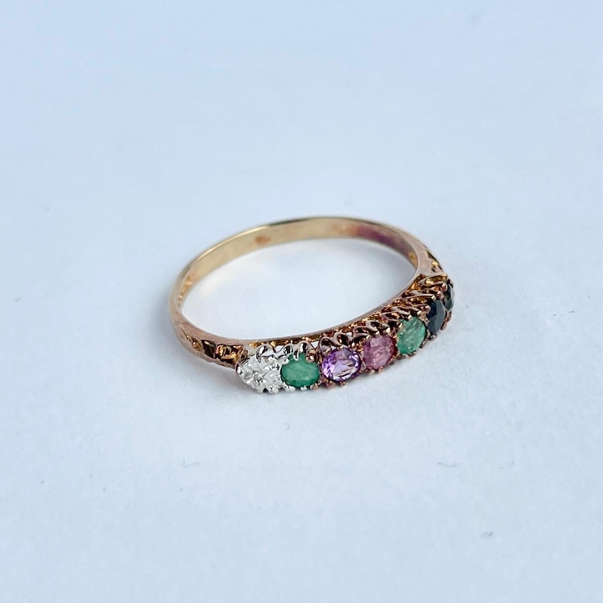A spectacular vintage dearest set with wonderful round cut stones, set so their initials spell 