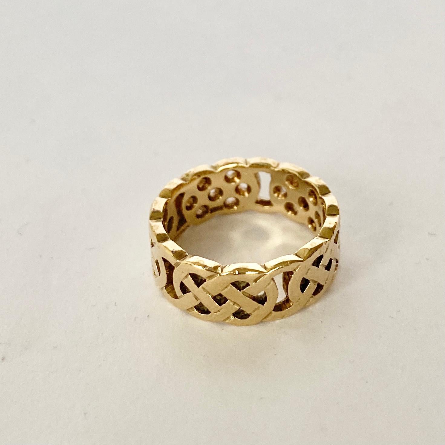 This band has a Celtic style to it and is modelled in 9carat gold. Fully hallmarked 1956 London.

Ring Size: I 1/2 or 4 1/2 
Band Width: 7mm

Weight: 4g