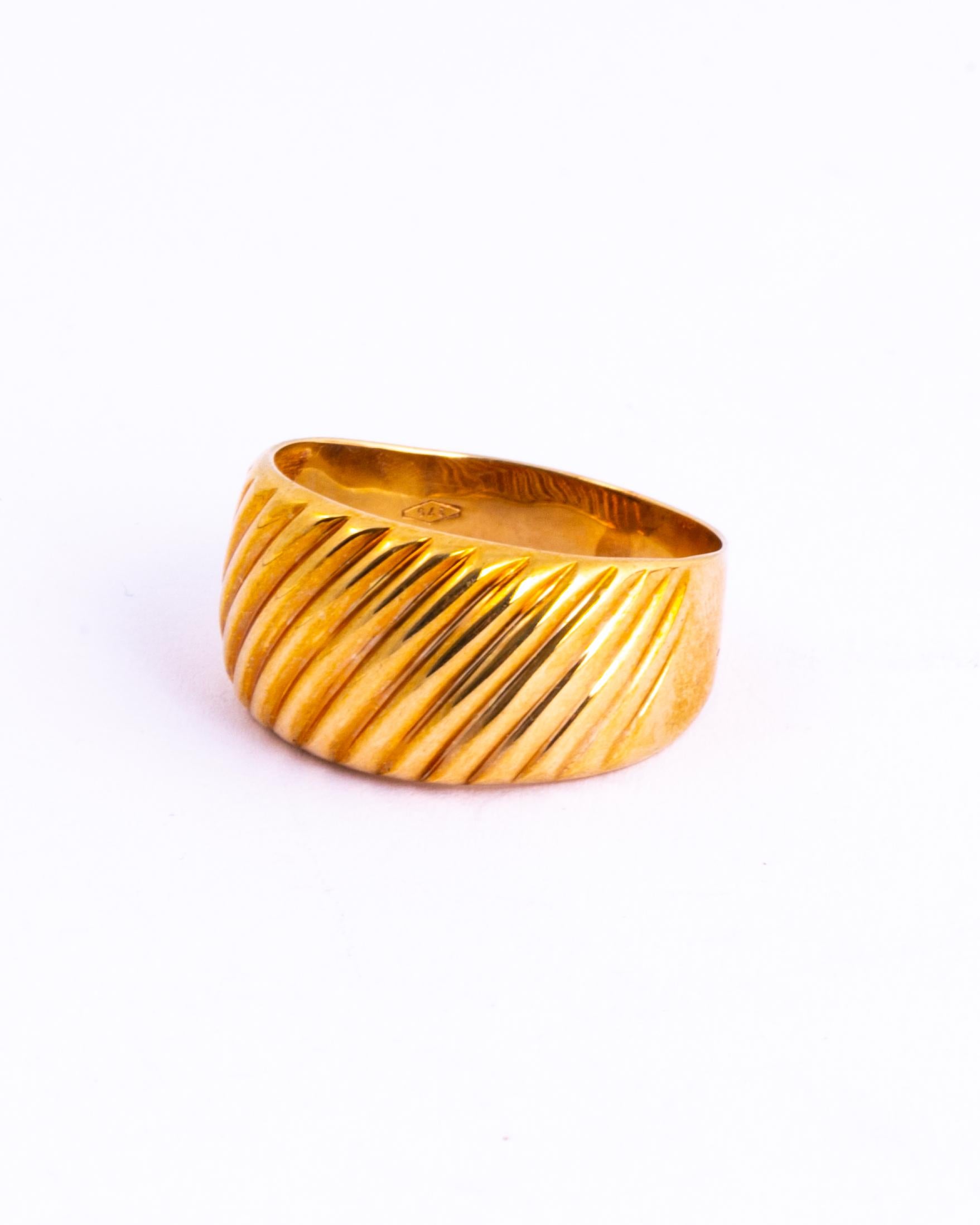 The design is like rippled gold. This would make a great fancy wedding band or an ornate everyday ring. Made in Chester, England.

Size: P 1/2 or 7 1/2 
Band Width: 10mm

Weight: 3.3g