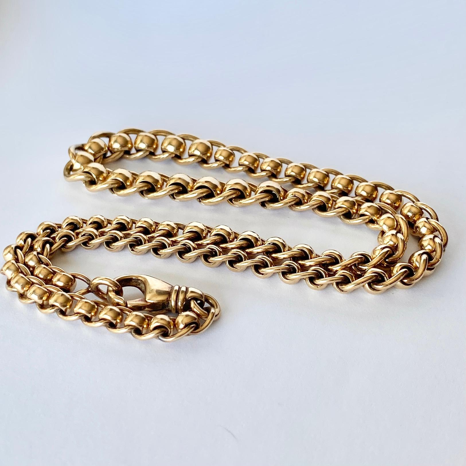 This 9carat gold necklace is made up of glossy beads and links. The necklace is fastened with a simple clasp and loop. 

Length: 43cm
Width: 8-5.5mm

Weight: 41g