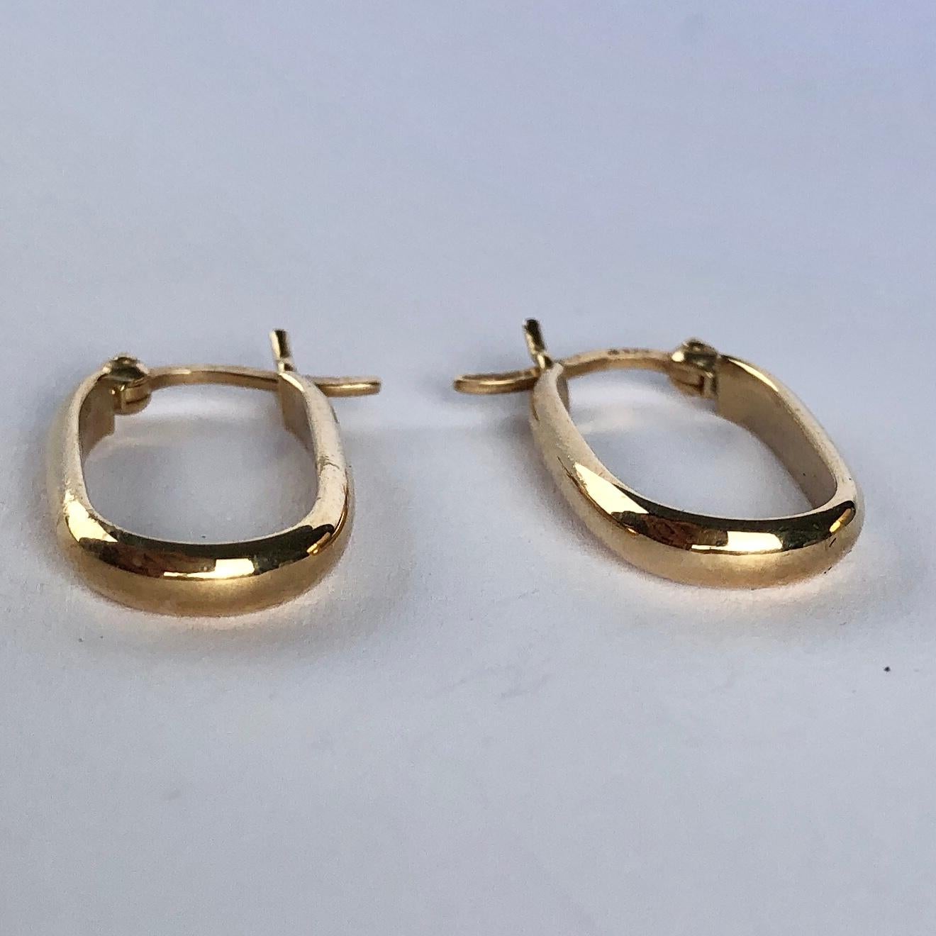 The earrings are modelled out of 9ct yellow gold and are a slim oval shape. They fasten with an easy push clip. 

Hoop Dimensions: 11x20mm 

Weight: 1.1g 
