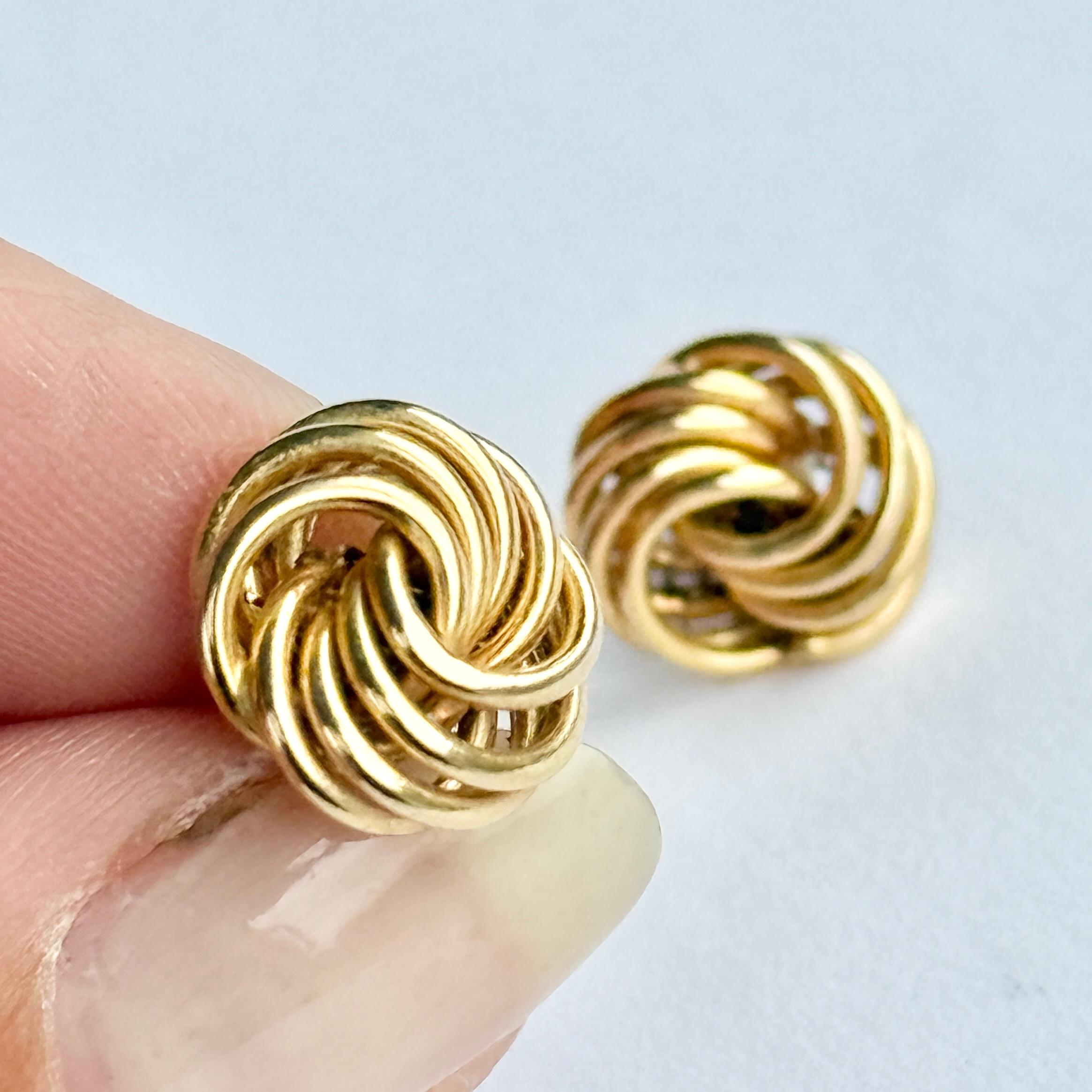 Glossy 9ct yellow gold superbly tied in a knot make the most stylish design for these earrings.

Knot Diameter: 13mm
Height From Ear: 5mm

Weight: 1.1g