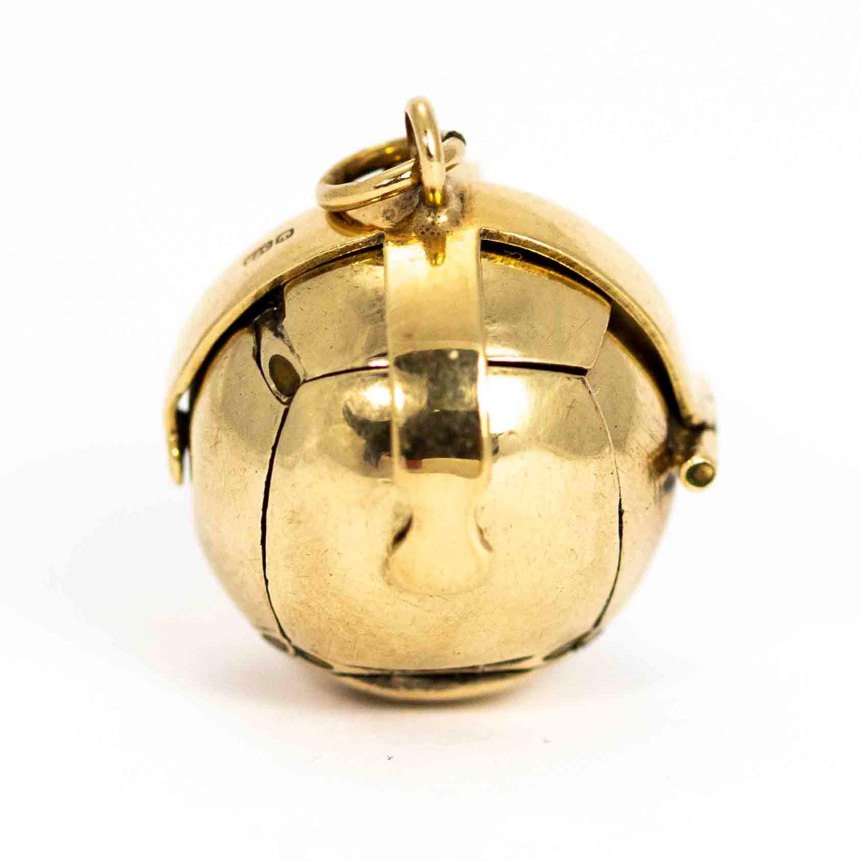 A wonderful vintage masonic orb pendant. The orb opens into a pendant in the shape of a cross comprised of 6 Pyramids and 24 expertly hand-engraved Masonic symbols, 4 symbols per pyramid. The orb has a 9 carat yellow gold shell with gilt