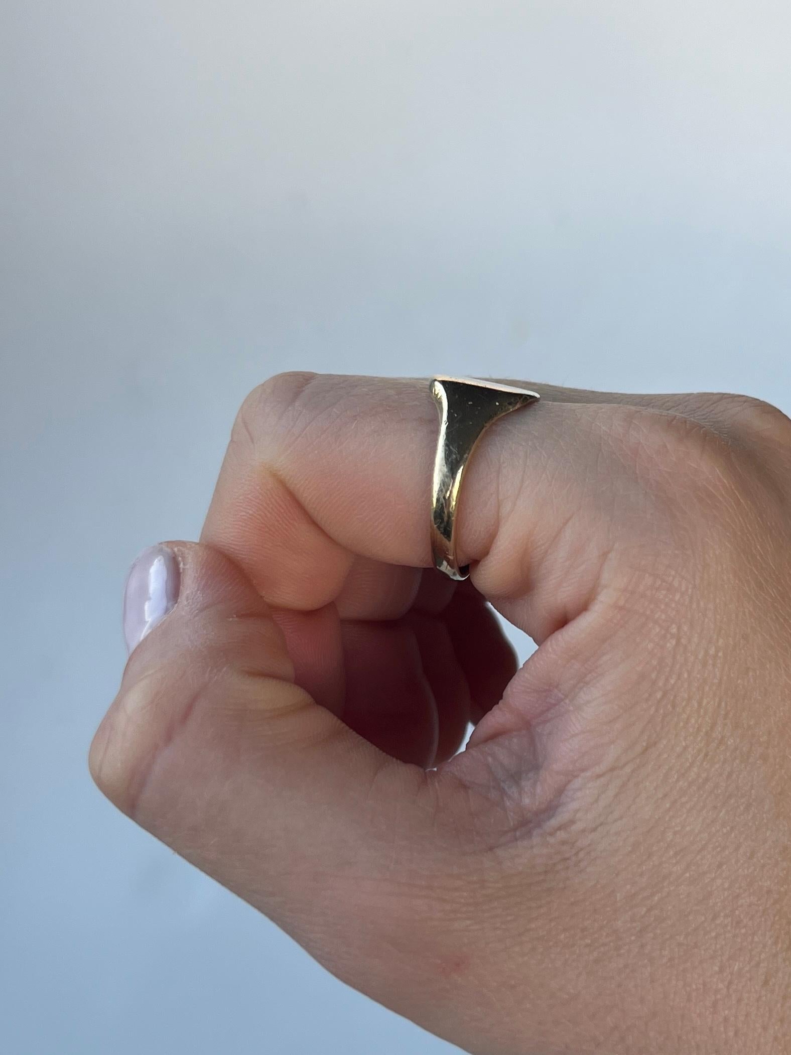 This masonic signet ring is modelled in 9 carat old and has a classic motif engraved in the gold face. Made in Birmingham 1972.

Ring Size: T 1/2 or 9 3/4
Widest point: 12mm 

Weight: 4.1grams 