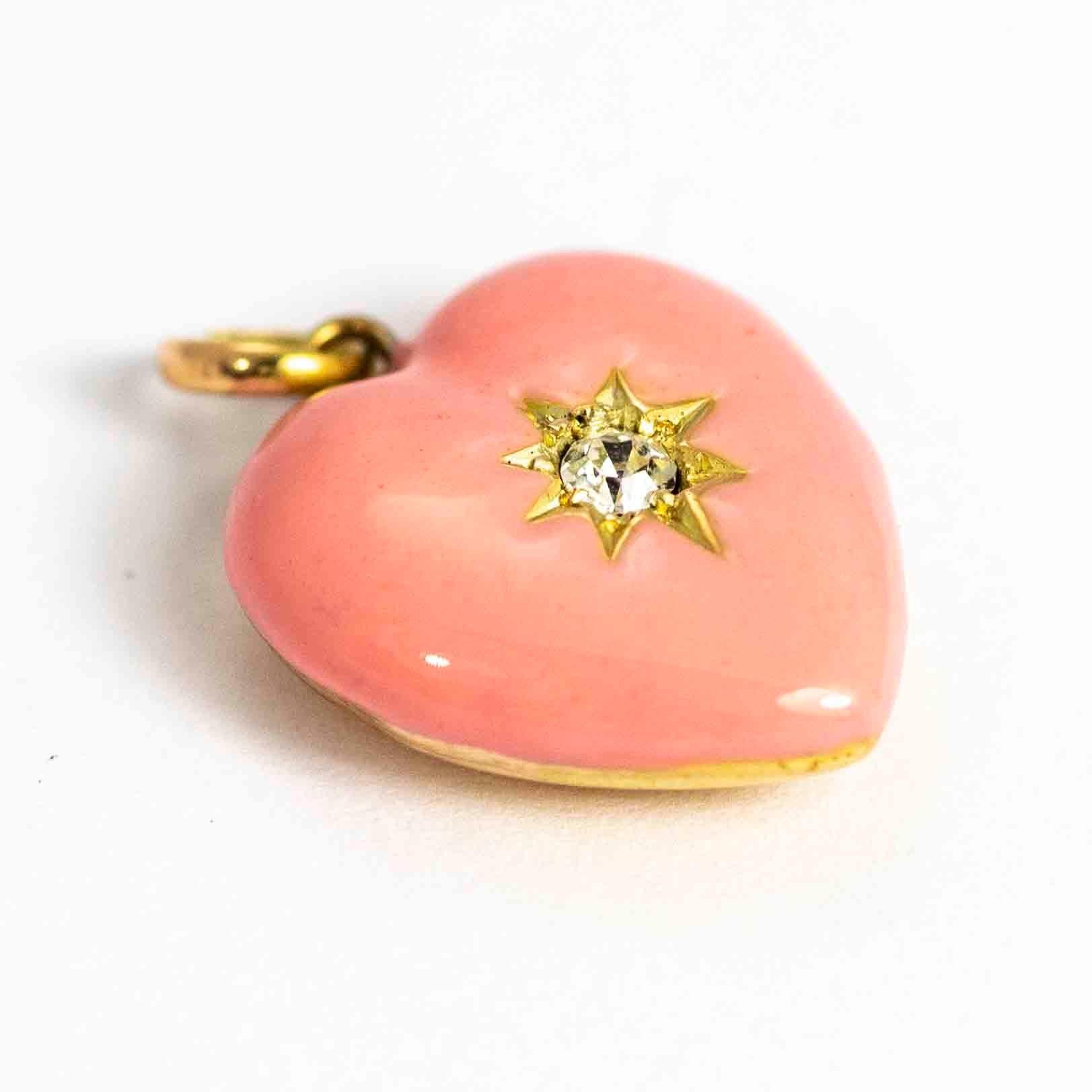 A stunning vintage heart pendant set with beautiful pink enamel and centred with an 8 point diamonds in a star setting. Modelled in 9 carat yellow gold

Height: 17mm      Width: 15mm

*please note there are a couple of small dents to the back of the