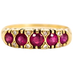 Vintage 9 Carat Gold Ruby Five-Stone Ring with Diamond Points Vintage 9 Carat Gold Ruby Five-Stone Ring with Diamond Points
