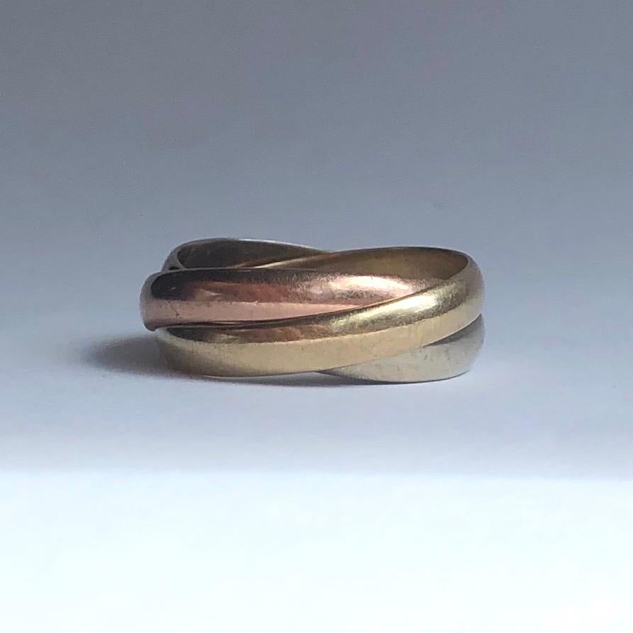 This triple band is made up of a white gold, yellow gold and rose gold band. Made in London, England and modelled in 9ct gold. 

Ring Size: L 1/2 or 6 
Band Width: 8mm

Weight: 4g