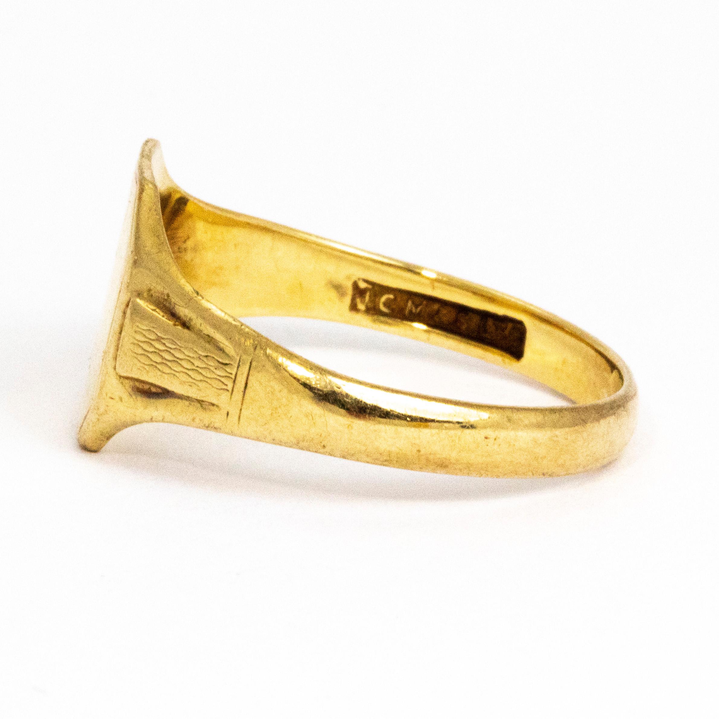 This lovely 9ct gold signet ring has some great detail. The Octagonal shape face on this ring has crisp edges and engraved like detail around it. The shoulders also have raised detail with engraving.

Ring Size: V or 10 1/2
Width At Widest Point: