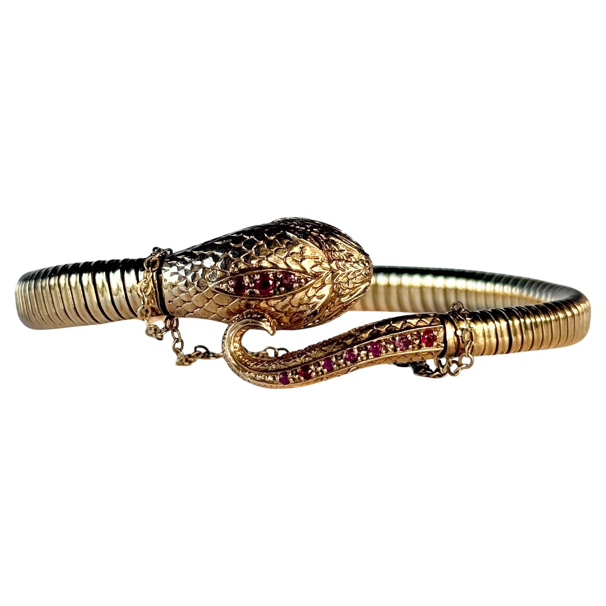 Pulsera vintage de serpiente de oro de 9 quilates engastada con rubíes