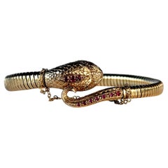 Pulsera vintage de serpiente de oro de 9 quilates engastada con rubíes