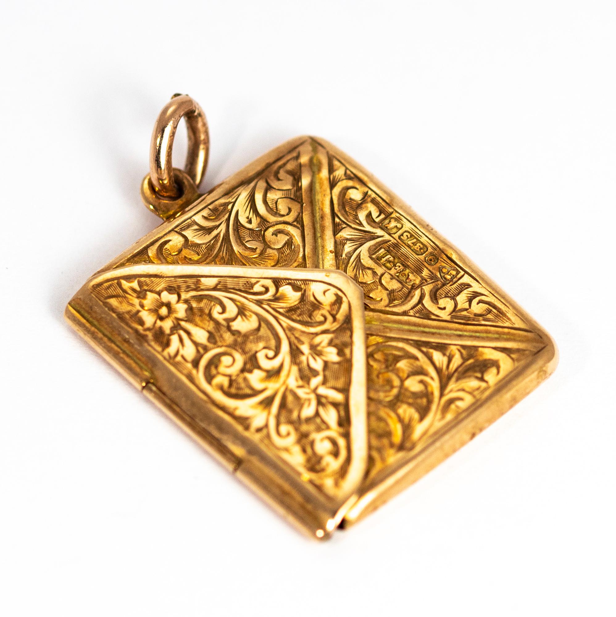 A stunning stamp envelope pendant made by Albert Ernest Jenkins in 1961. This piece is exquisitely hand chased with ornate designs front and back. Modelled in 9 karat yellow gold. 

Fully hallmarked 1961 Chester, England.