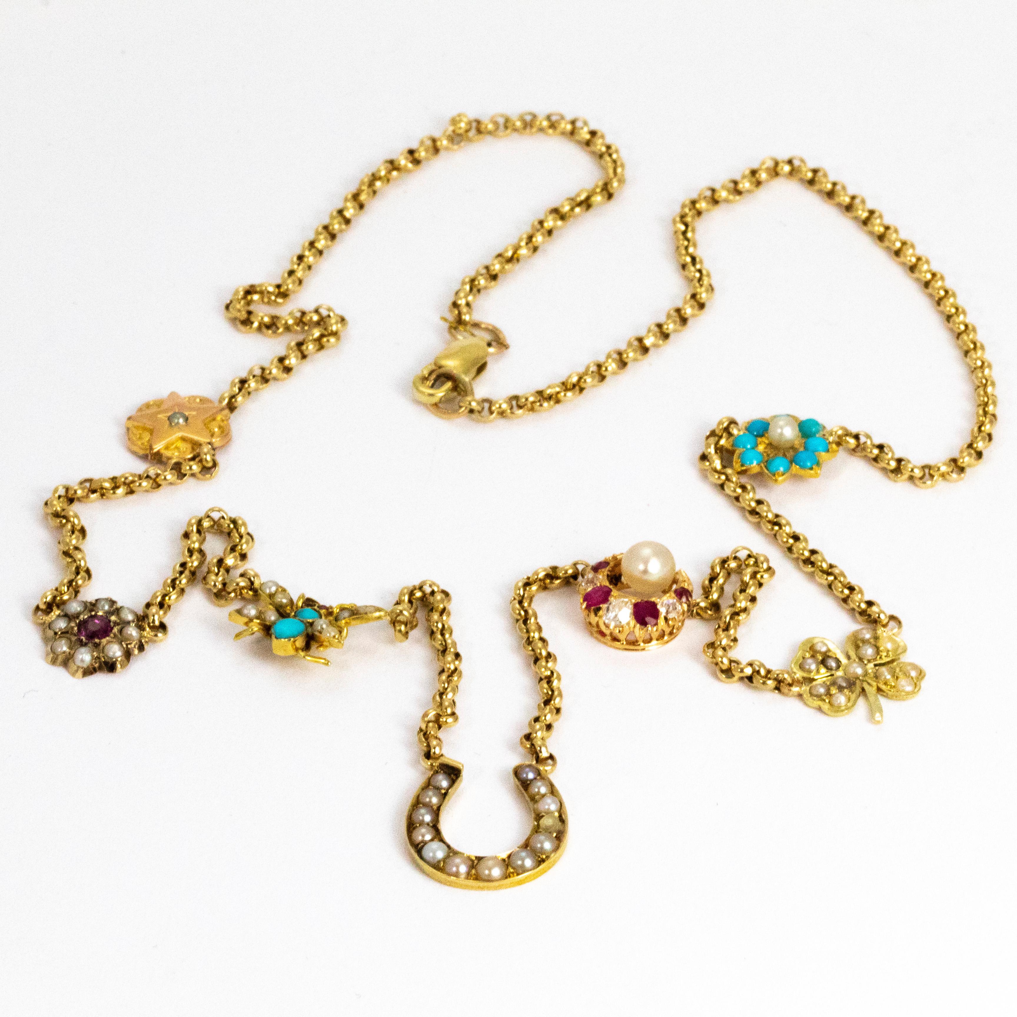 This necklace holds so many treats! Seven charms are placed around this necklace in total. A glossy gold star featuring a pearl at the centre, a ruby at the centre of a pearl cluster, the sweetest butterfly set with turquoise and pearl, a lucky