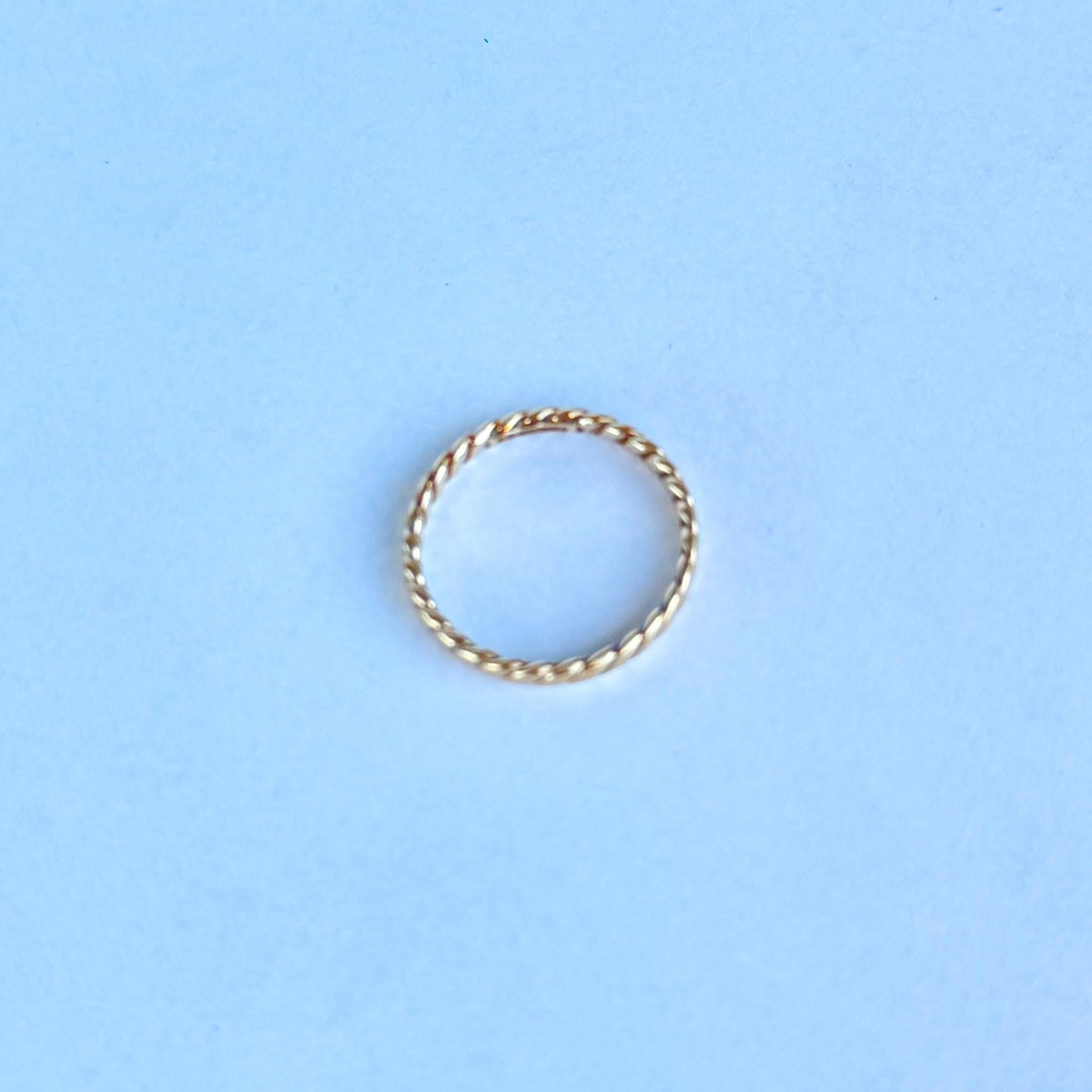 This yellow gold ring is modelled out of 9 Carat gold. Fully hallmarked London 1982.

Ring Size: K or 5 3/4
Band Width: 2mm

Weight: 0.8g 