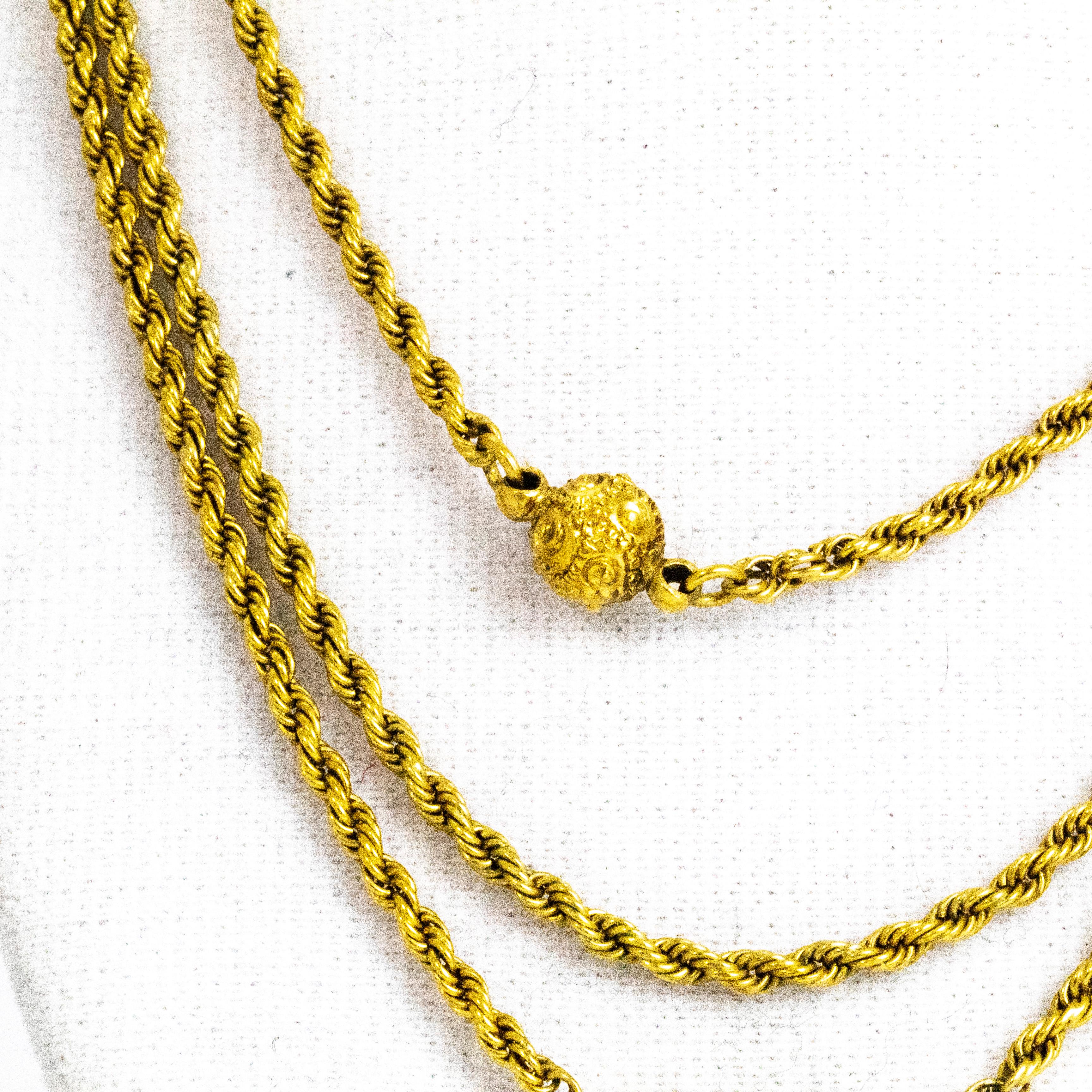 The orbs on this rope twist chain are absolutely stunning. Each one has so much intricate swirling engraving on it. The necklace has one barrel clasp at the back but holds three separate chain to give the rifle tier look. The chain itself goes