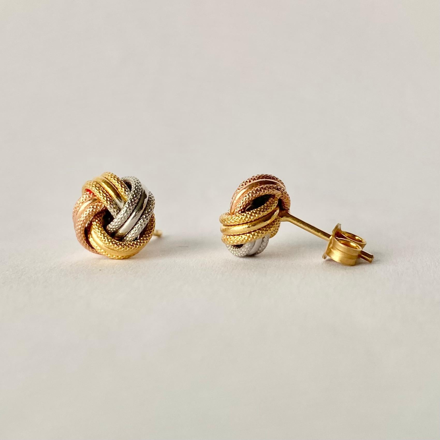 Glossy 9ct yellow, rose and white gold superbly tied in a knot make the most stylish design for these earrings. 

Knot Diameter: 9mm
Height From Ear: 6mm

Weight: 0.77g
