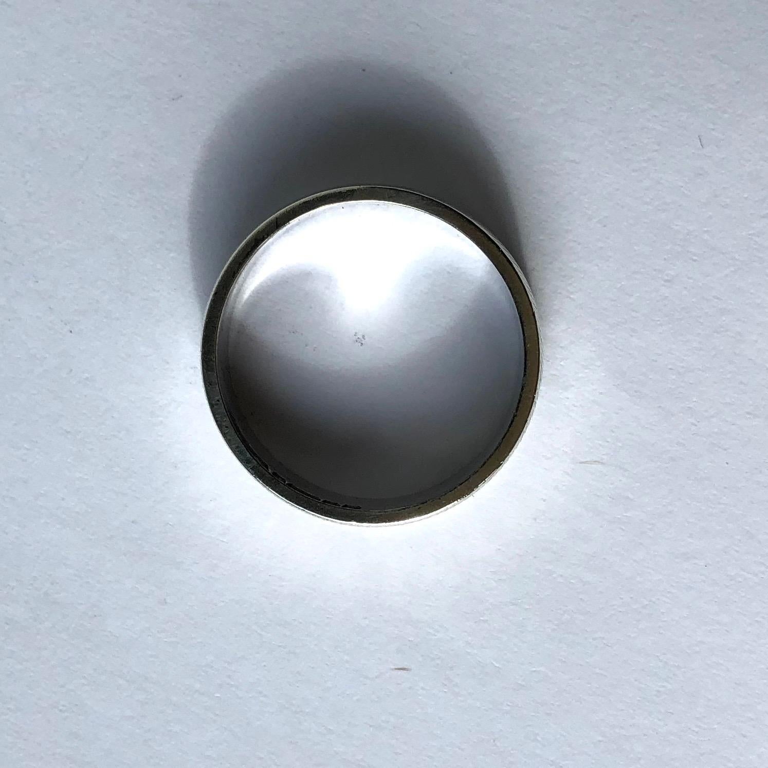 A sweet finely engraved 9ct white gold band. Perfect for a simple every day ring or ornate wedding band.

Ring Size: M 1/2 or 6 1/2
Band Width: 5mm

Weight: 3.9g