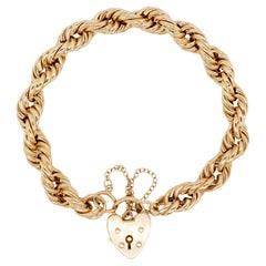 Bracciale d'epoca in oro giallo 9 carati a maglie intrecciate con lucchetto a cuore, 1977