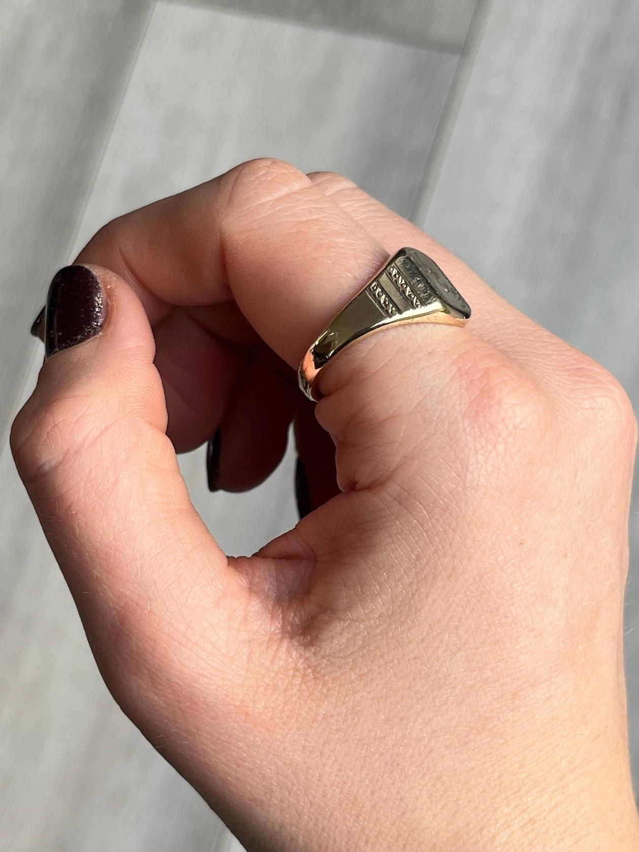 This signet ring is modelled in 9 carat gold and has a chunky feel to it. It has ACG engraved into the face. 

Ring Size: T or 9 1/2 
Face Dimensions: 12x10mm

Weight: 7.5g
