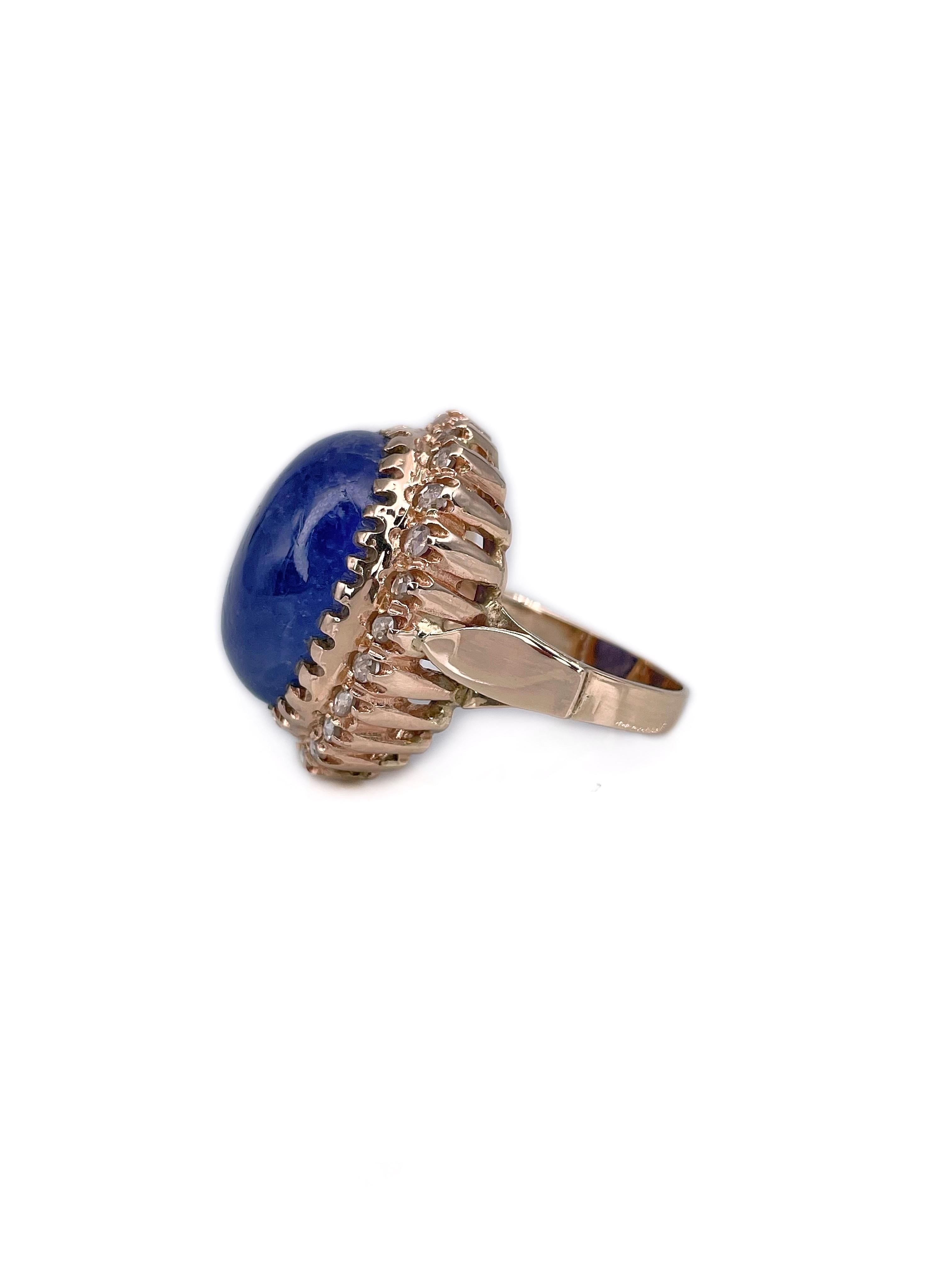 This is a vintage cocktail ring crafted in 9K gold. Circa 1960. 

The piece features:
- 1 tanzanite, oval, cabochon cut, 19.00ct, V 6/3, P3
- 24 diamonds, rose cut, TW 0.70ct, RW-STW, SI-P1

Weight: 12.22g 
Size: 17.5 (US 7)

IMPORTANT: please ask