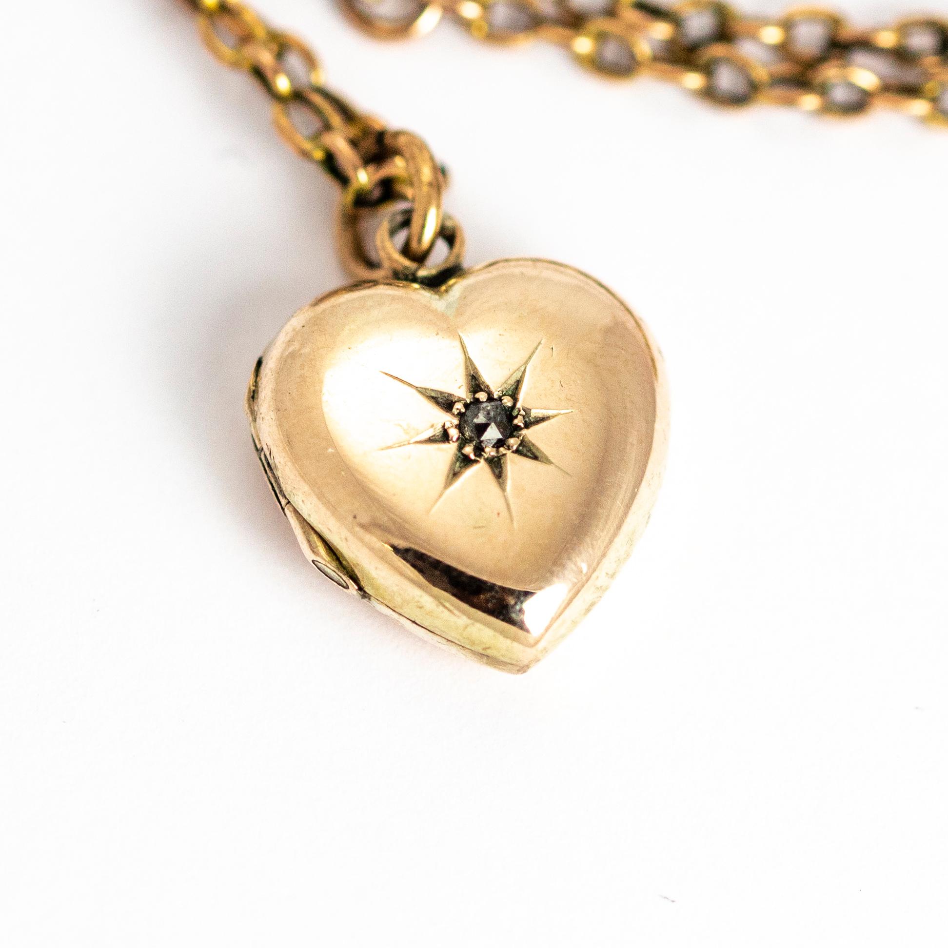 A beautiful vintage small heart-shaped locket set with a rose cut diamond in a radiant eight pointed star setting. The locket sits on a chain measuring 24.9 cm (9.8 inches). All modelled in 9 karat yellow gold

Locket Height: 1.5 cm

Locket Width: