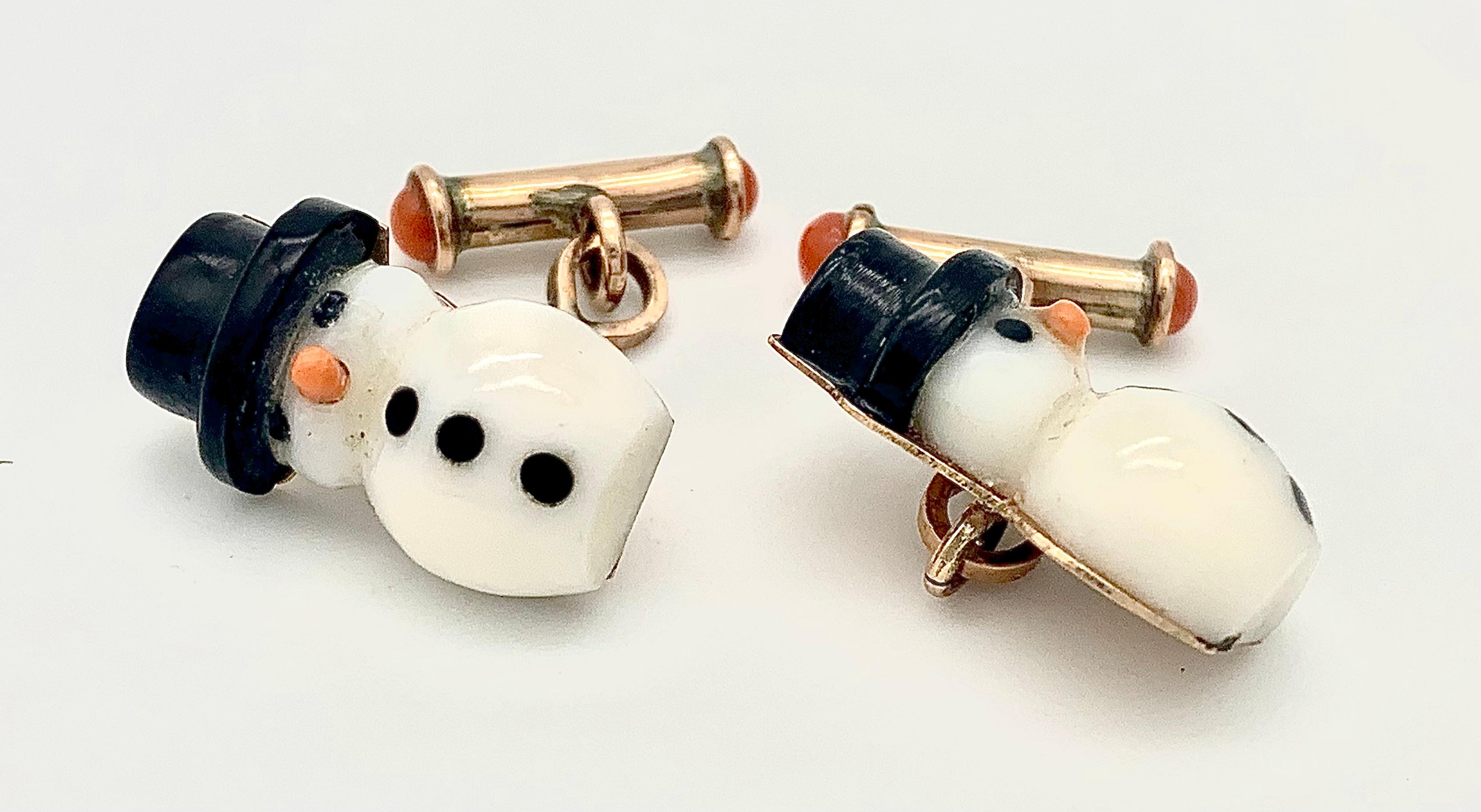 These charming cufflinks have been made out of 9 karat gold and feature two snow men made out of black, white and red glass. The cufflinks are marked 395 on the reverse.