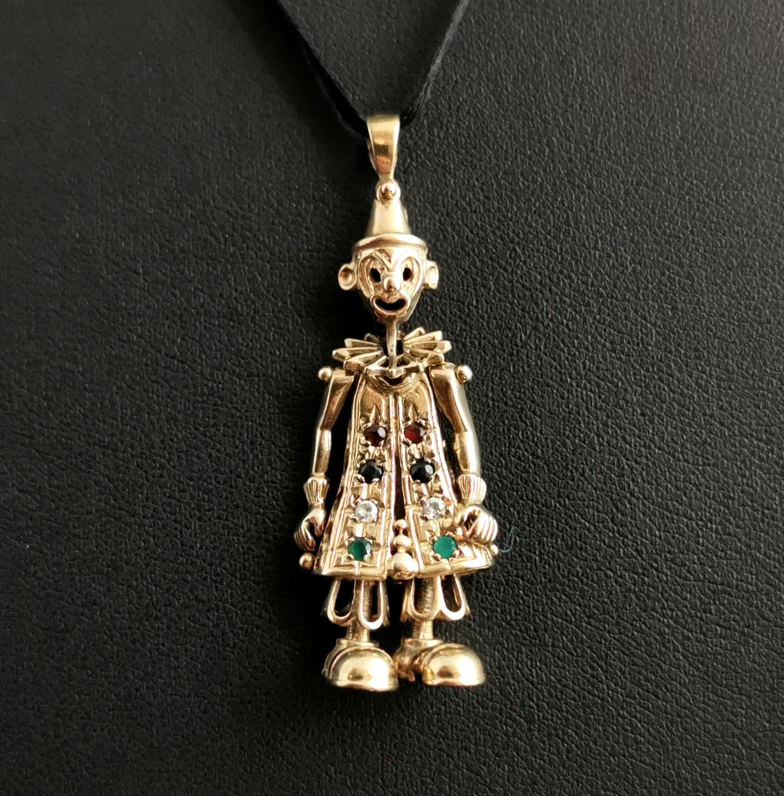 A fantastic vintage 9kt yellow gold articulated clown pendant.

A classic favourite from the 90s this clown pendant has movable limbs and is set with paste, Sapphire, Garnet and cubic zirconia stones to the front.

A great novelty piece, a good