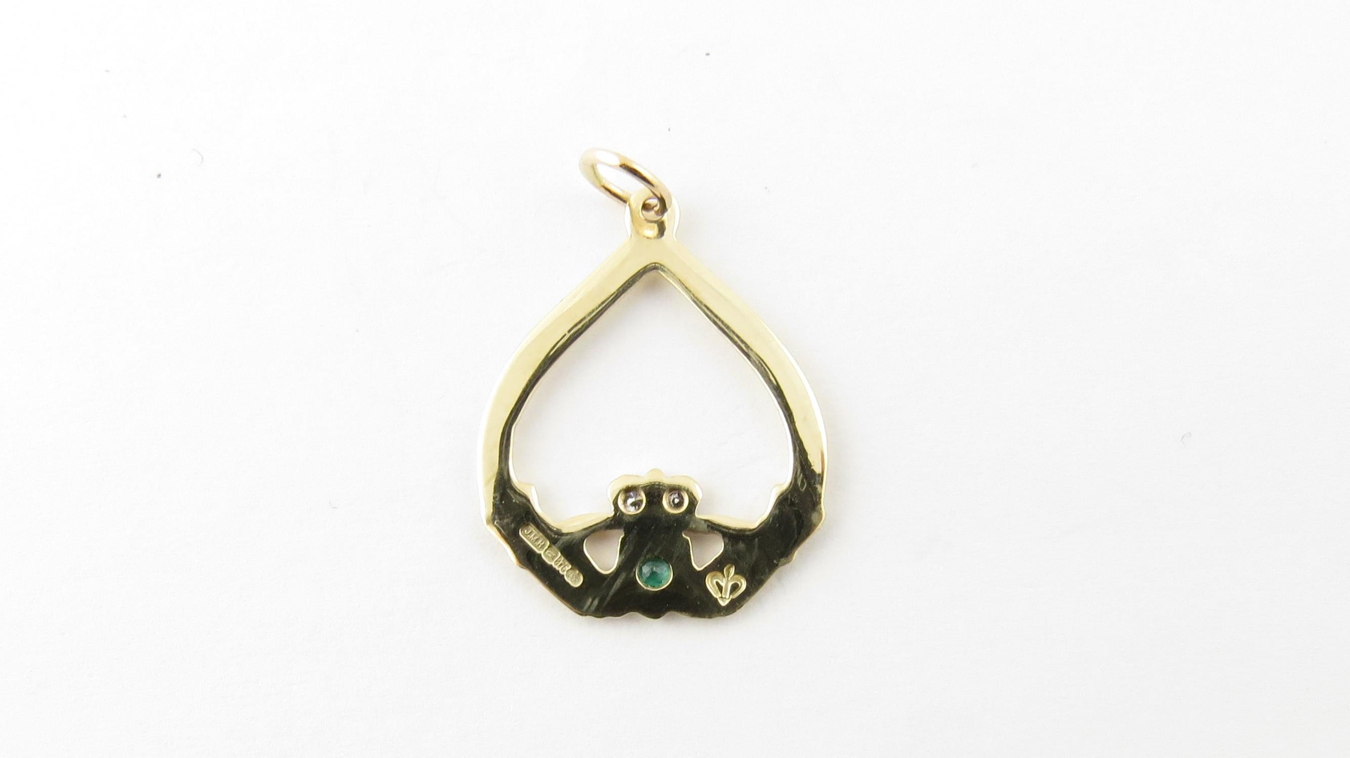 Vintage 9 Karat Yellow Gold Emerald and Diamond Claddagh Pendant

The traditional Irish Claddagh is a symbol of friendship, love and loyalty.

This lovely Claddagh pendant is accented with two round brilliant cut diamonds and one round genuine