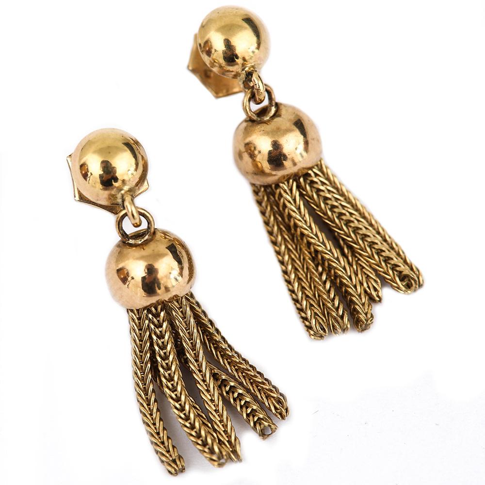 A pretty pair of vintage 9 Karat yellow gold fringe tassel drop earrings, the link is a foxtail pattern, being hinged from a gold cup fitting. Made in 1987 in Birmingham these pre-loved earrings are fully and clearly hallmarked on both the post and