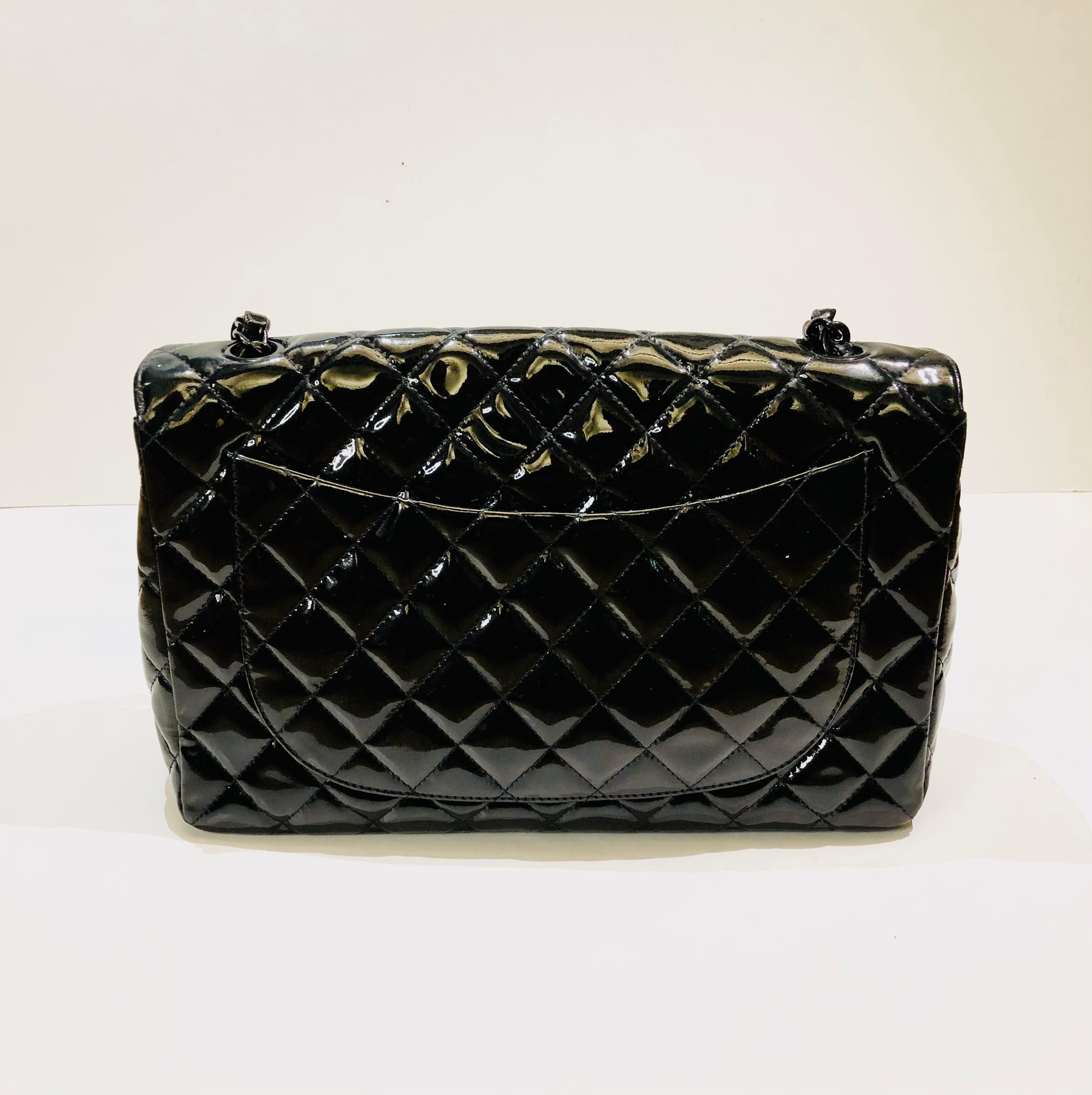 - Chanel black quilted patent leather shoulder flap bag. 

- Featuring a black hardware 