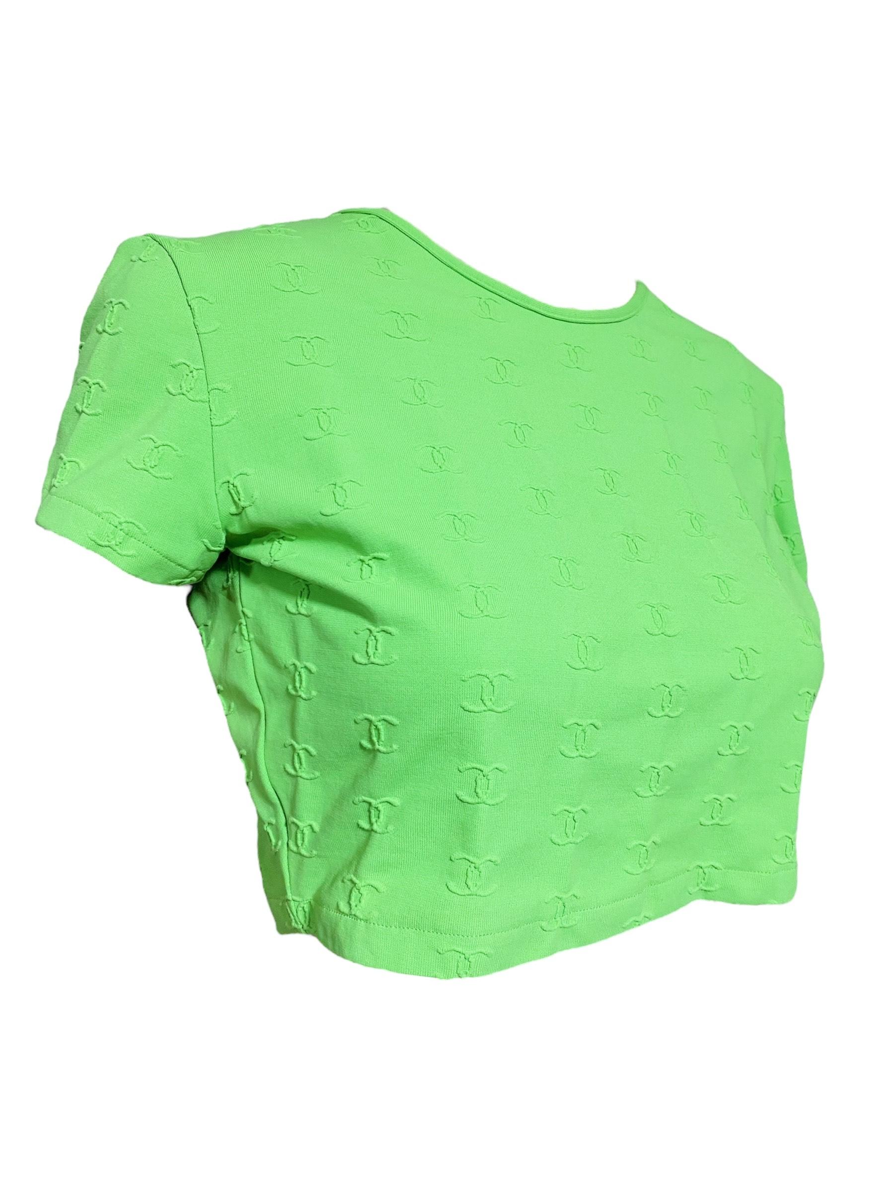 Iconic and extremely hard-to-find Chanel top. Karl Lagerfeld designed it in 1997 for Coco Chanel.  This Crop Top is made of a polyester blend and features embroidered logos in green. 

Designer: Chanel
Dimensions (Inches) (Taken Flat)
Length: