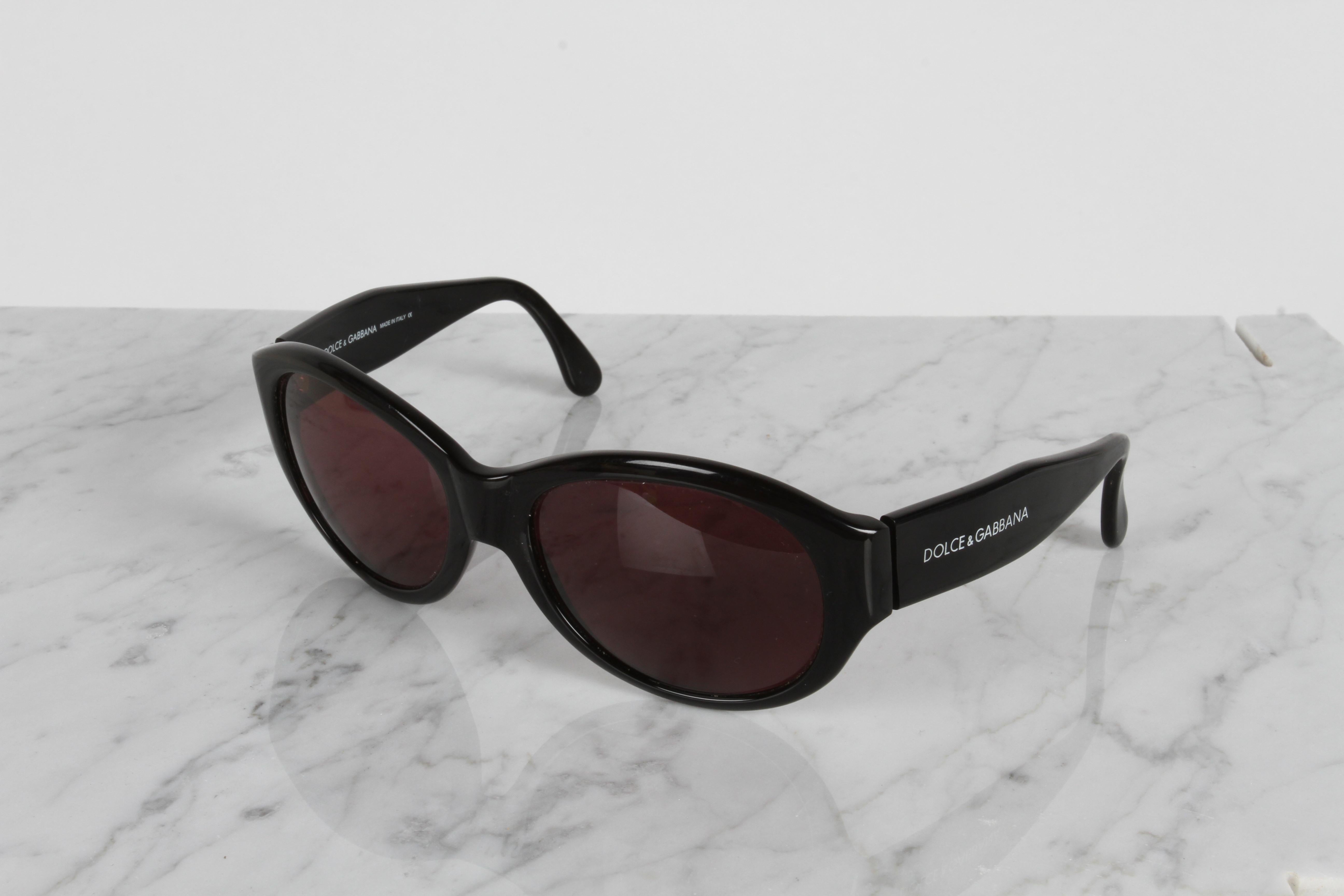 Fabulous 1990s Dolce & Gabbana designer women's Oval Fly Sunglasses with black frame & rose lenses. Marked on frames : Dolce & Gabbana 511S, Made in Italy. 
 
 Inside dims between arms is 5.75