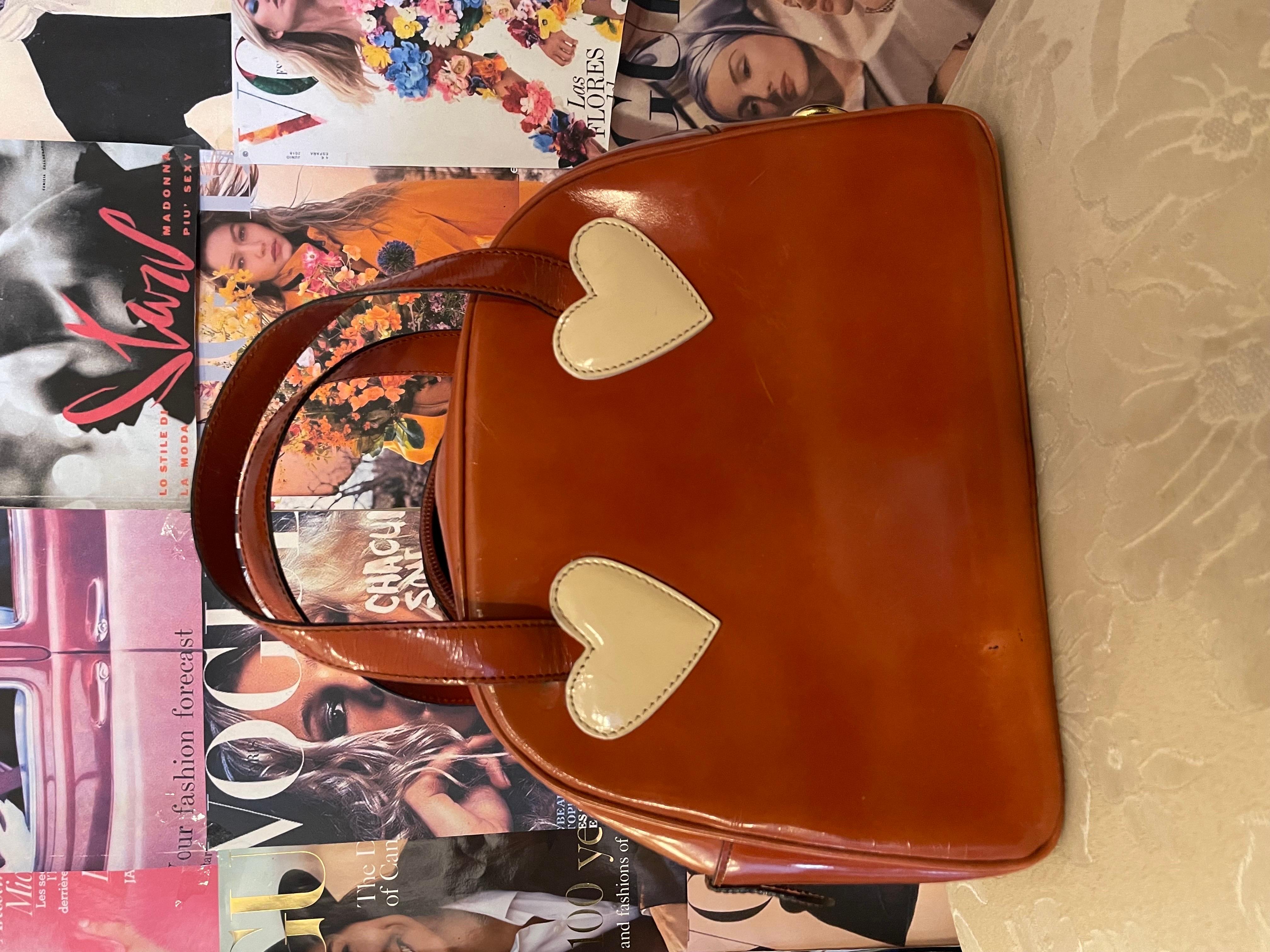 Vintage 1990s Moschino by redWall bowling bag, the Red and black version as been seen on Fran fine on the hit sitcom the Nanny. 
Vintage yet still fashion and trendy. 
Minor signs of use but barely noticeable in good condition inside and outside.