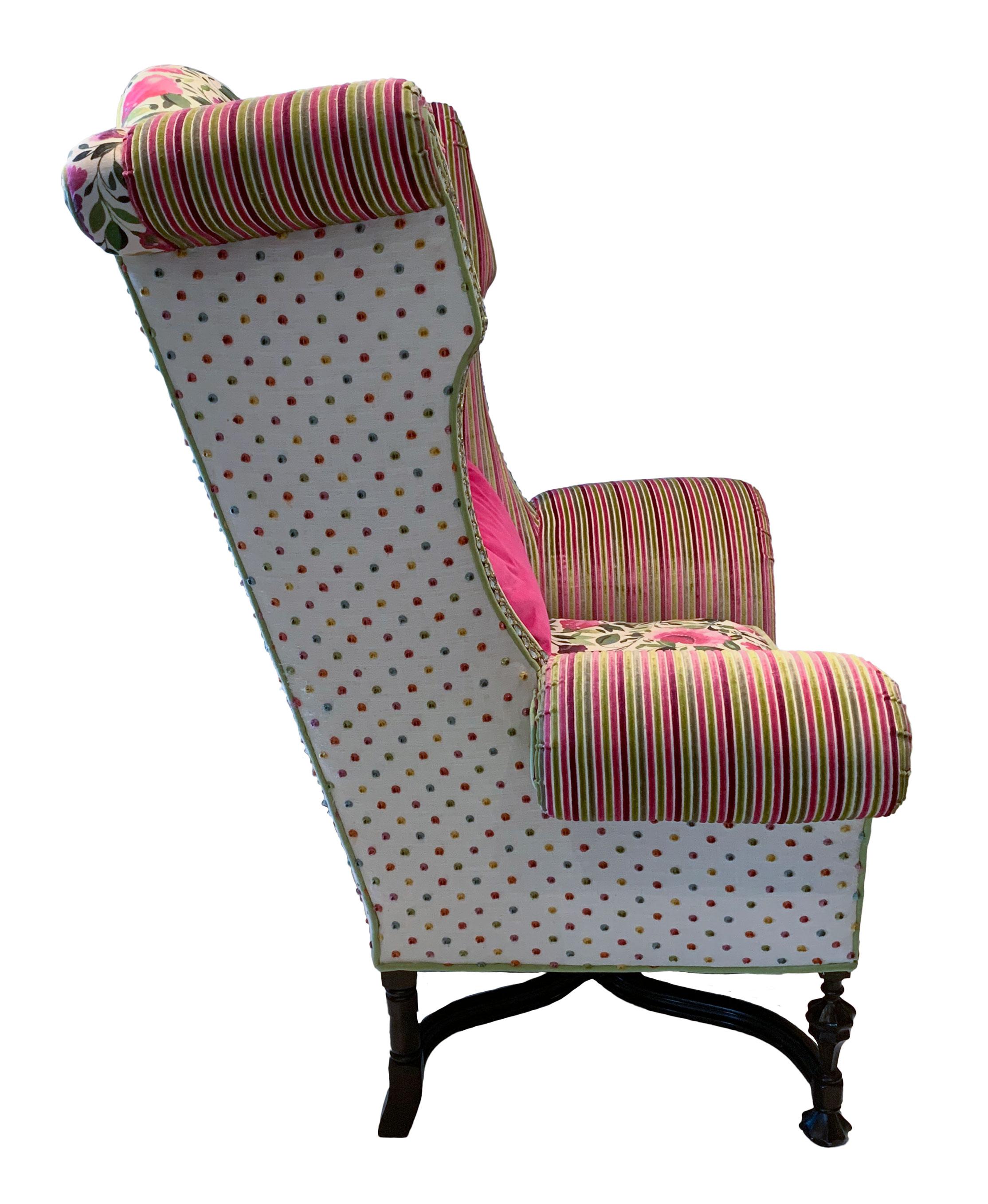 Vintage 1990s William & Mary Style Monumental Wingback armchair with rolled arms. Fully refurbished and reupholstered in an eclectic collage of pink and green fabrics from Designers Guild-UK, Clarke and Clarke-UK, and Kate Spade. This chair is very