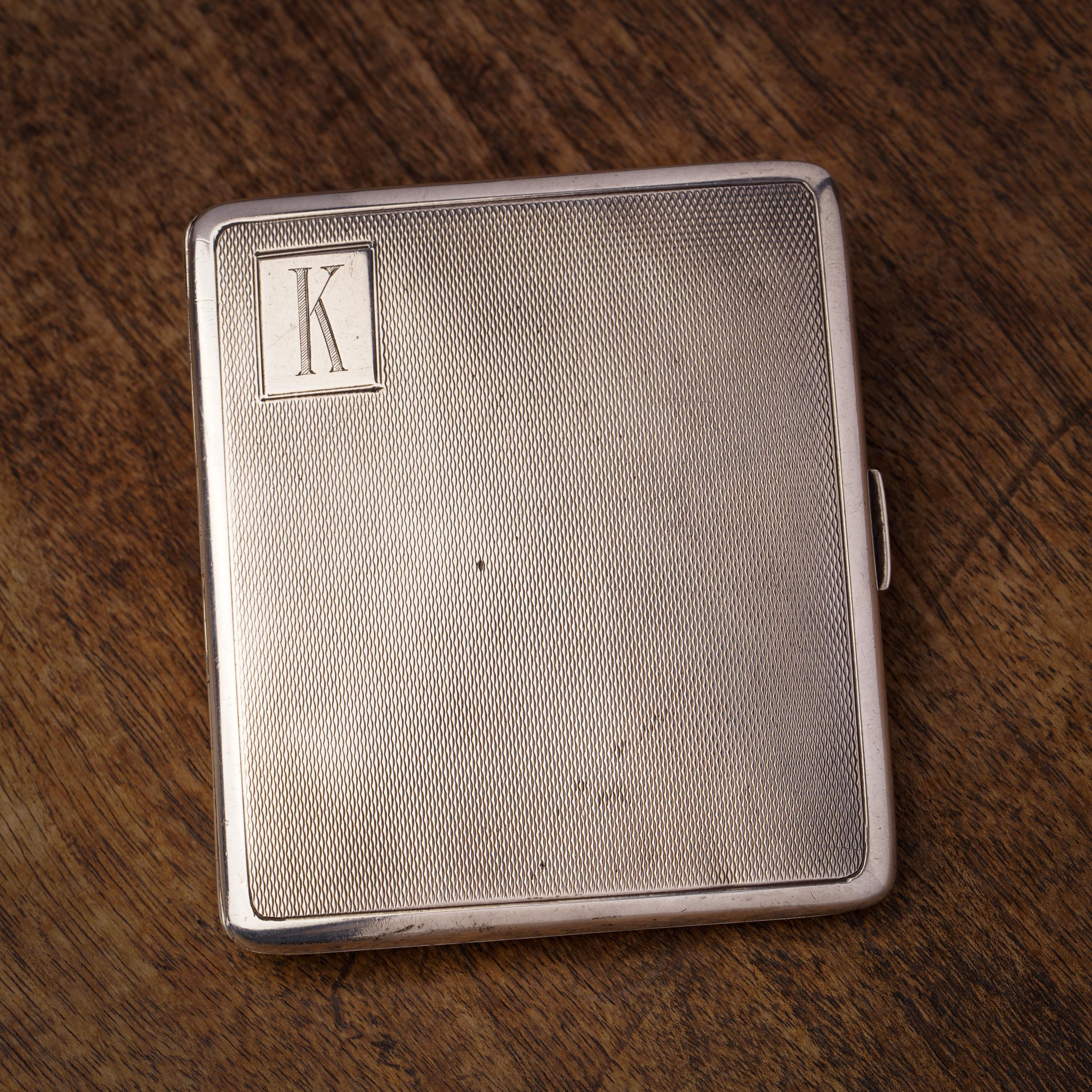 Vintage 925 Sterling Silver Engine Turned Cigarette Case with Initial 'K'

Crafted in England, specifically in Birmingham, in 1934, this vintage cigarette case is made of 925 sterling silver and features an elegant engine-turned design. The case