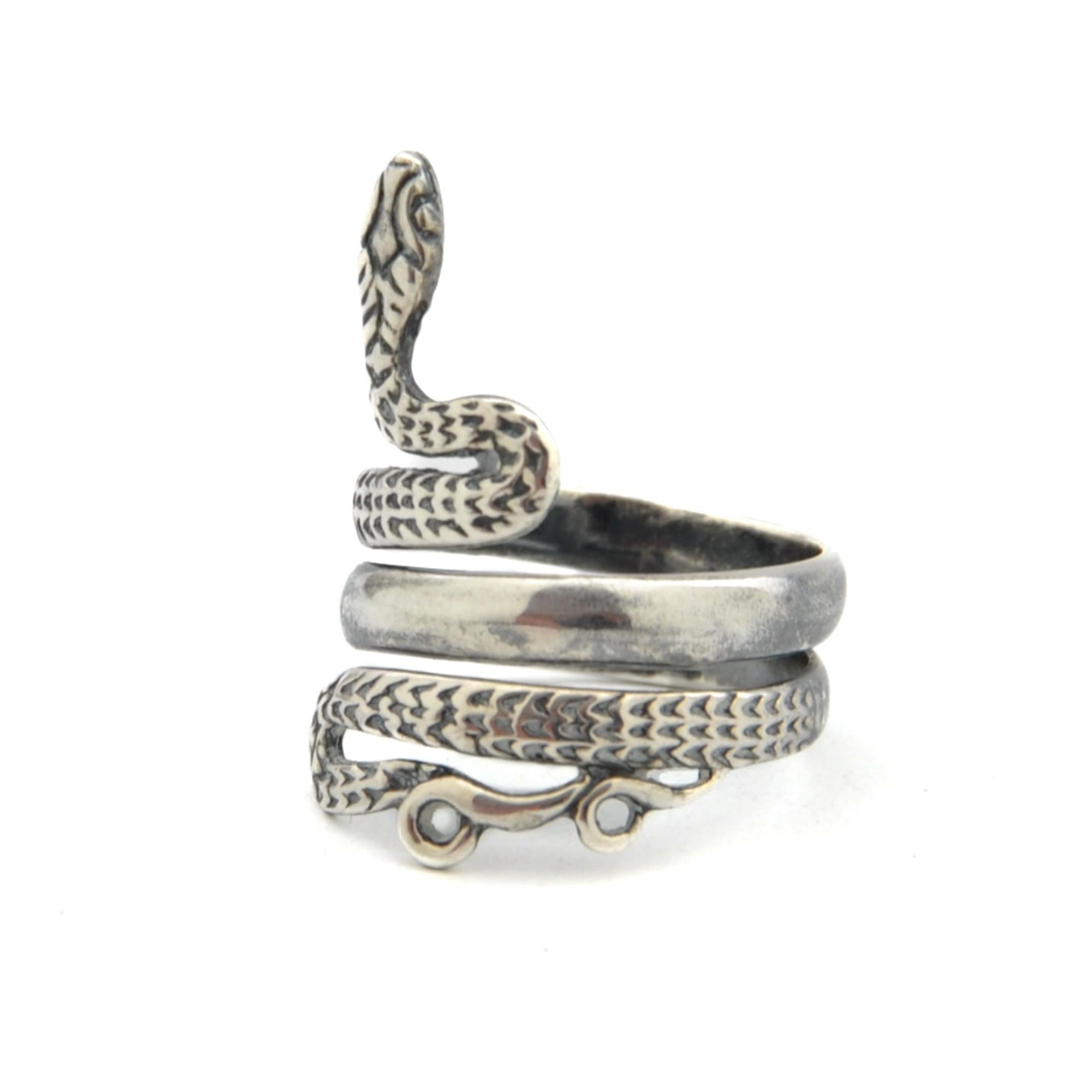 This beautiful snake ring and made of sterling silver. The ring is a real asset to any collection. The snake represents transformation and rebirth. You can wear the ring alone or you can wear it with your other favorites. The silver has a worked